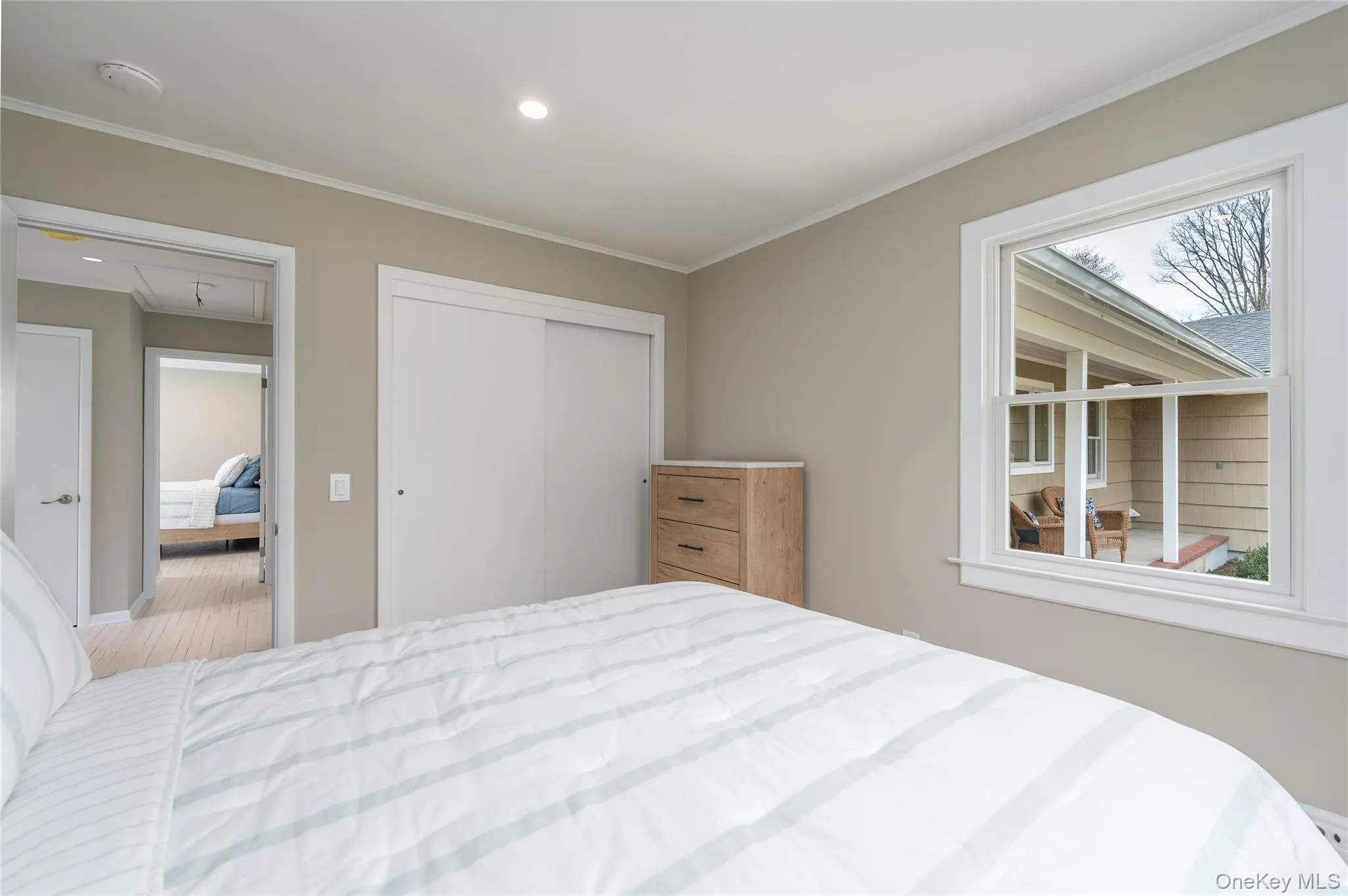 Bedroom featuring recessed lighting, a closet, ornamental molding, attic access, and baseboards Bedroom featuring recessed lighting, a closet, ornamental molding, attic access, and baseboards