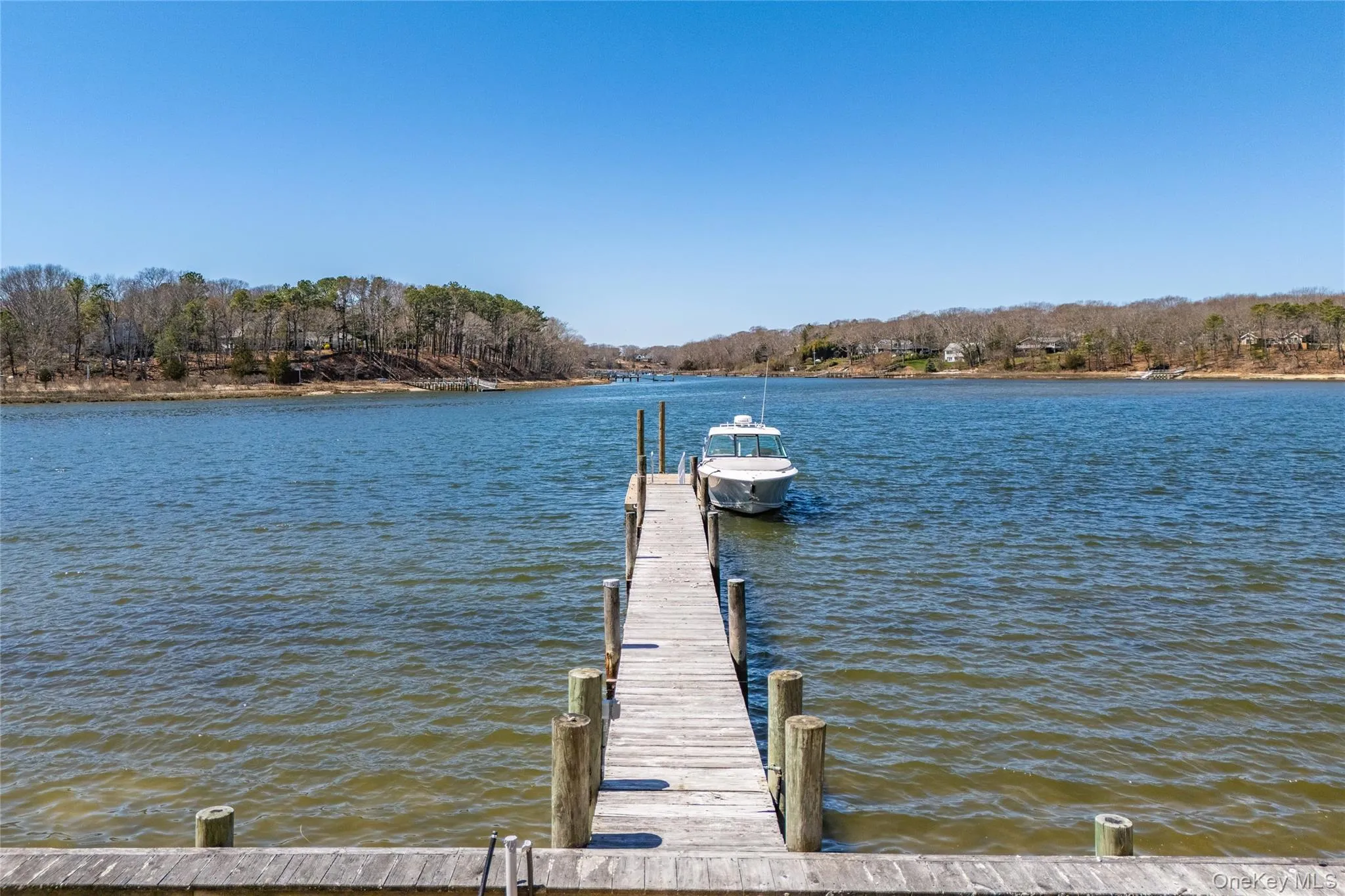 View of dock featuring a water view View of dock featuring a water view