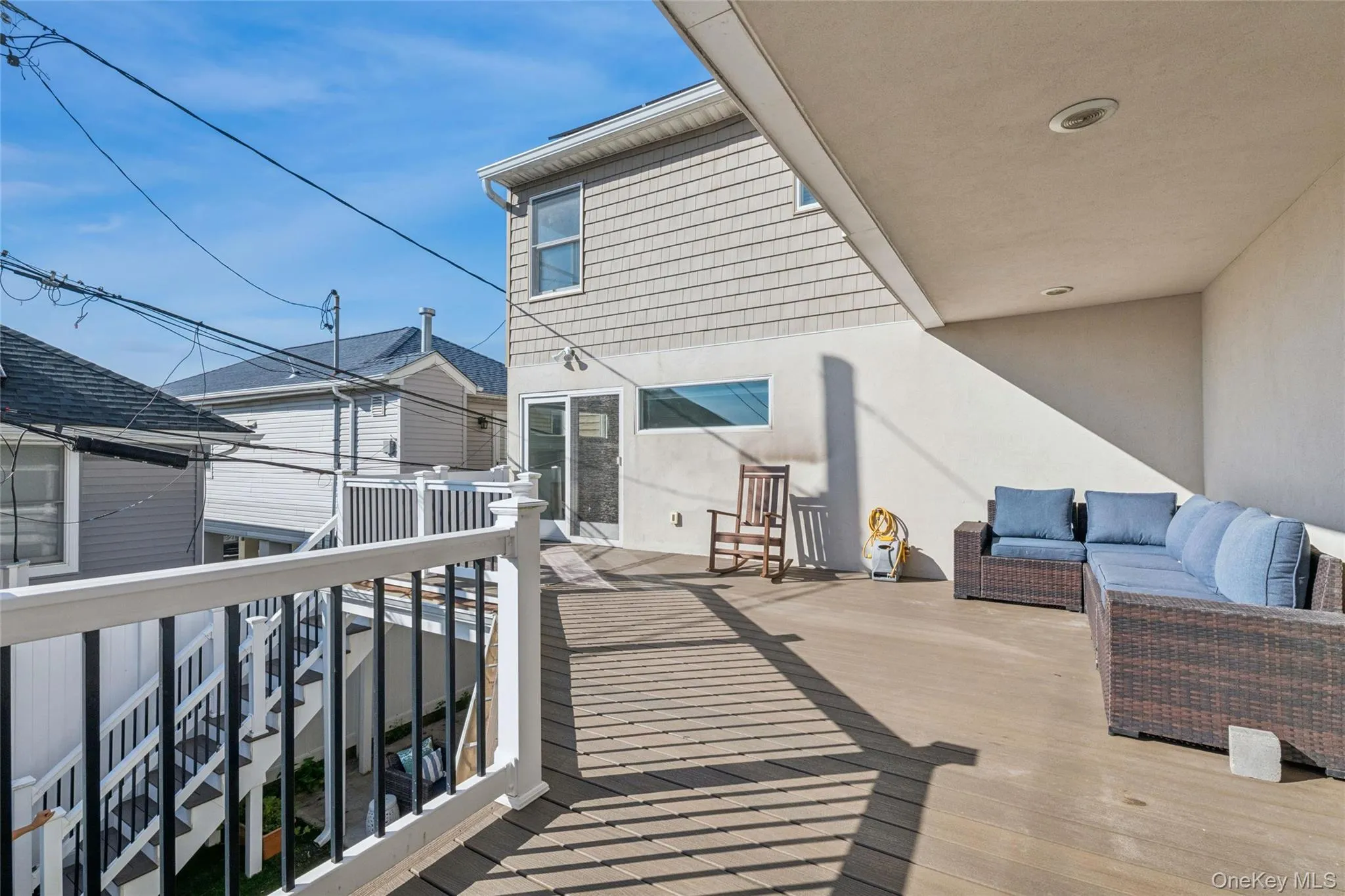 Wooden terrace with stairs and an outdoor hangout area Wooden terrace with stairs and an outdoor hangout area