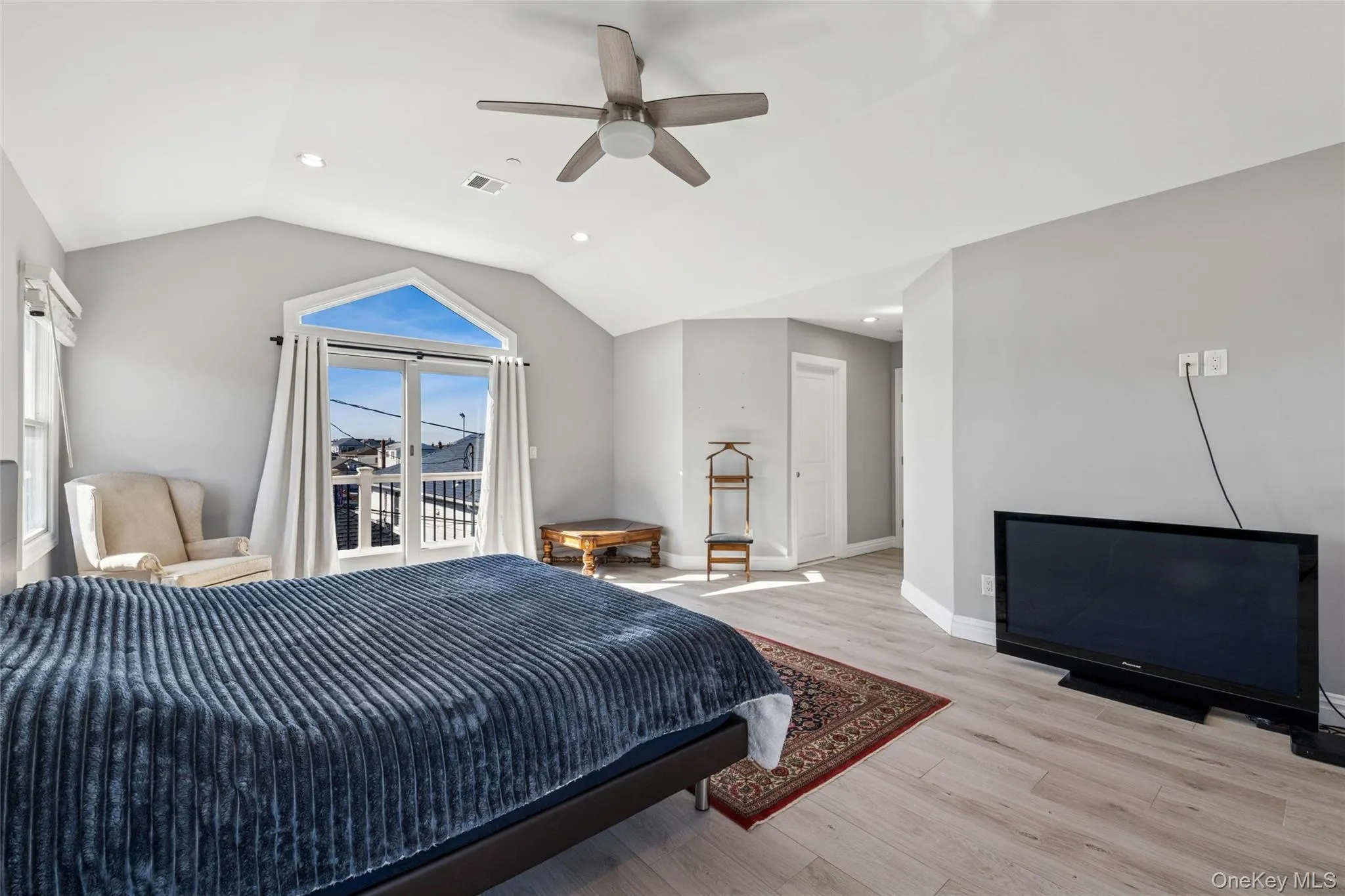 Bedroom with wood finished floors, lofted ceiling, recessed lighting, ceiling fan, and access to outside Bedroom with wood finished floors, lofted ceiling, recessed lighting, ceiling fan, and access to outside
