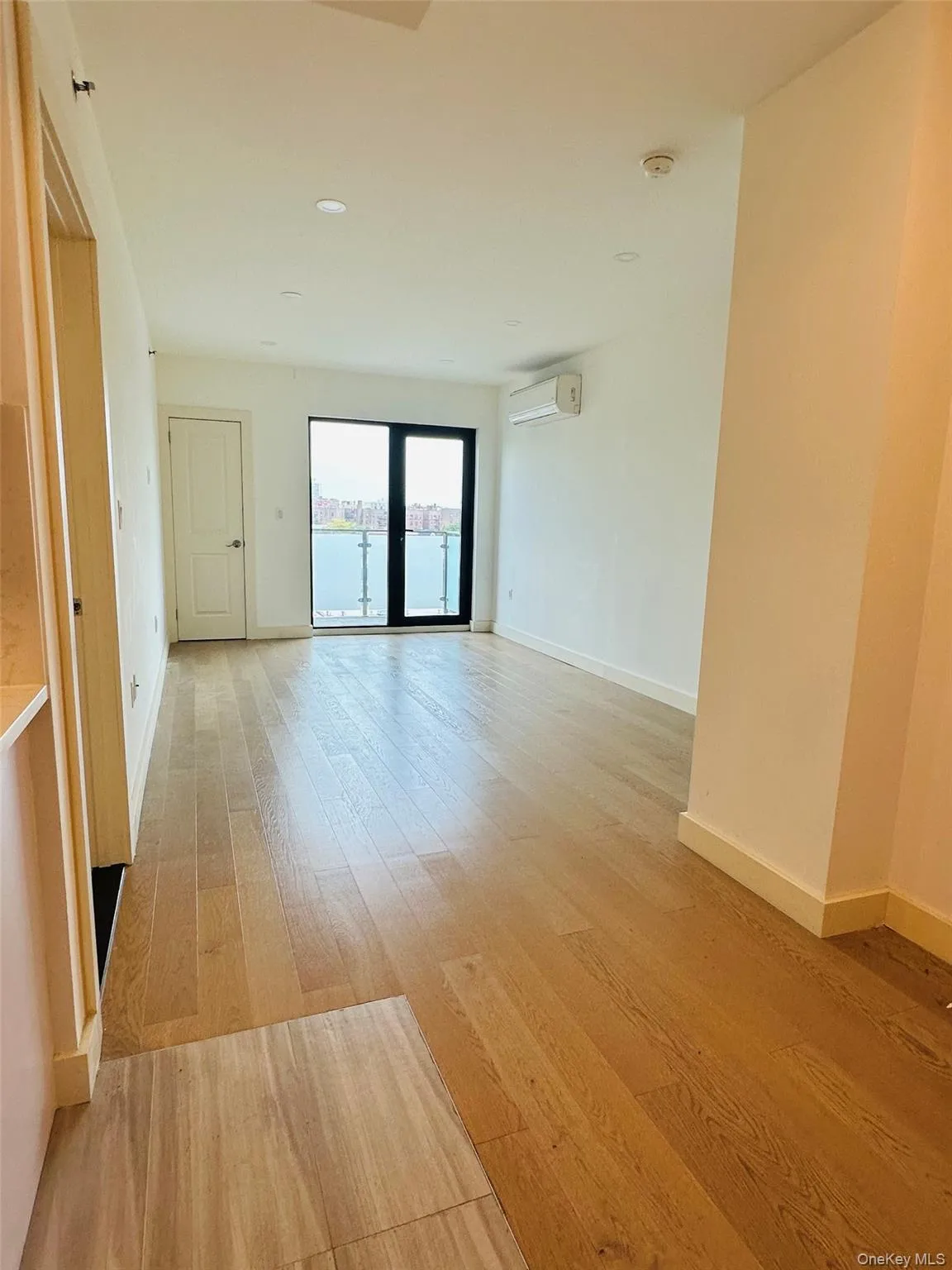 Unfurnished room with light wood-style floors and recessed lighting Unfurnished room with light wood-style floors and recessed lighting