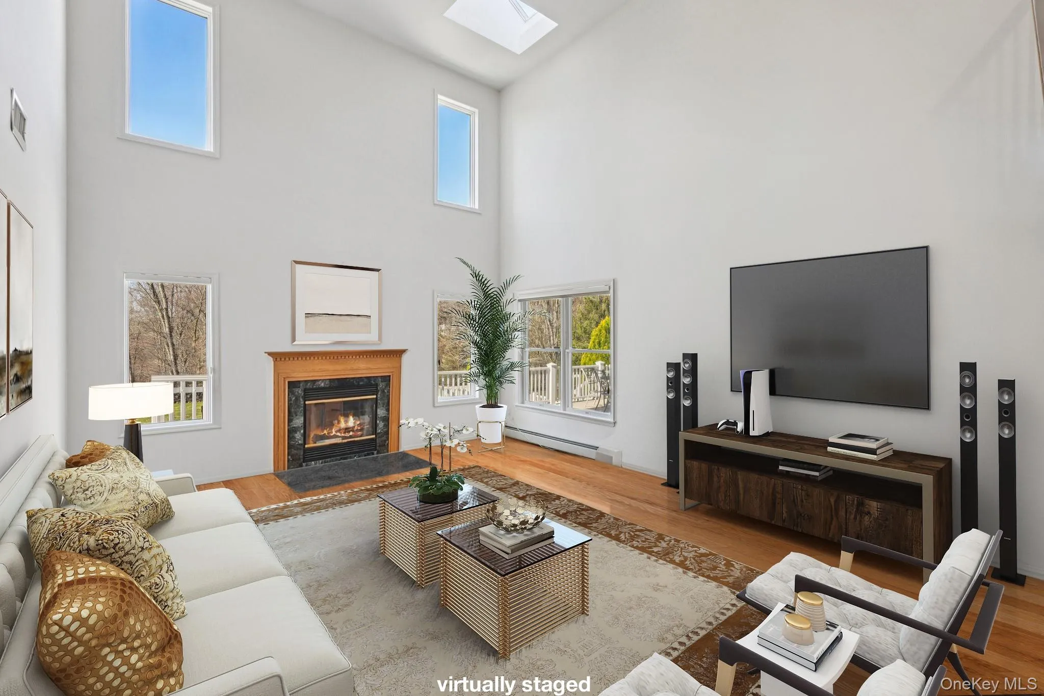 2 story great room has sky lights and a wood burning fireplace 2 story great room has sky lights and a wood burning fireplace