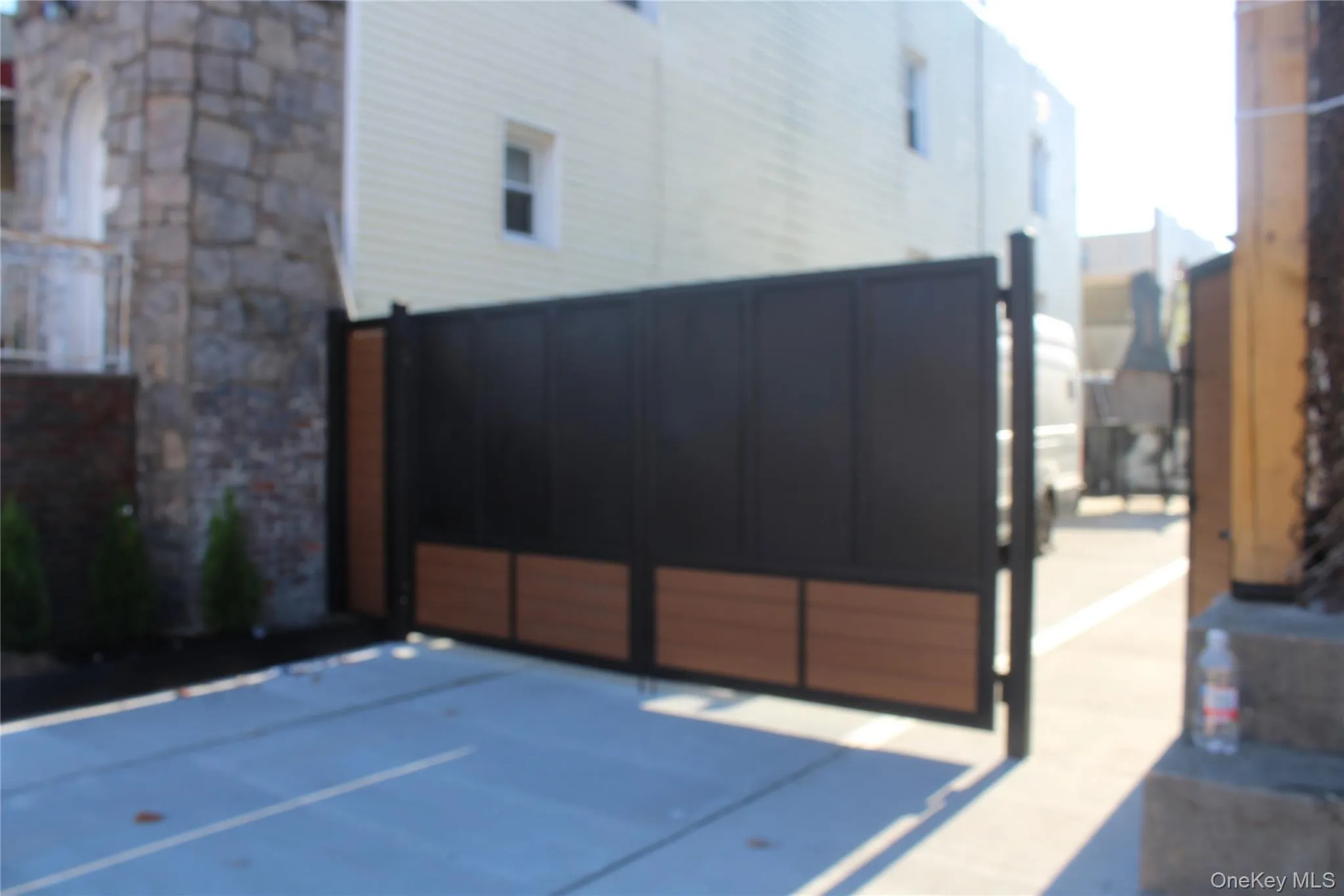 View of property exterior with a package area and stone siding View of property exterior with a package area and stone siding