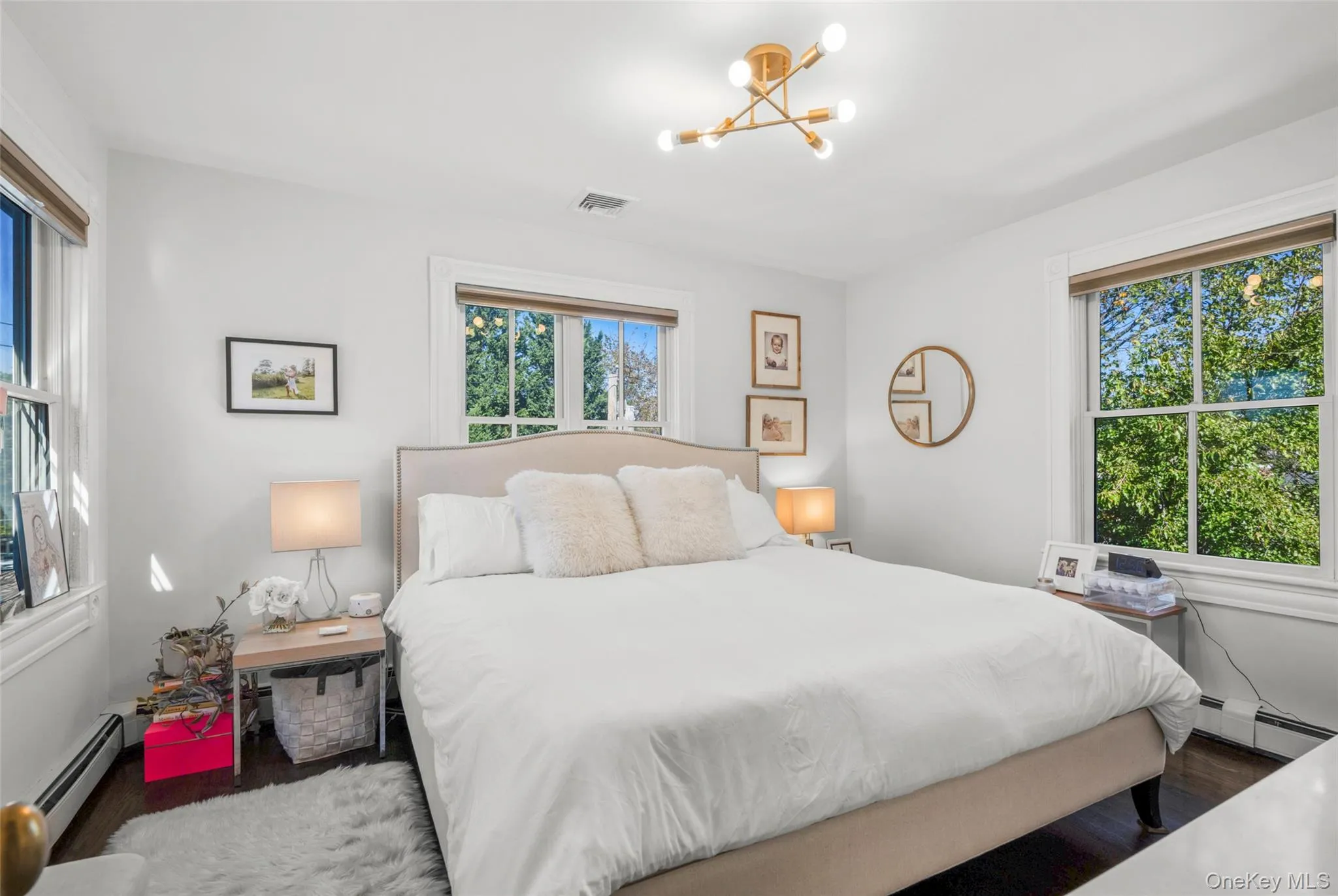 Bedroom featuring hardwood floors and large closet Bedroom featuring hardwood floors and large closet