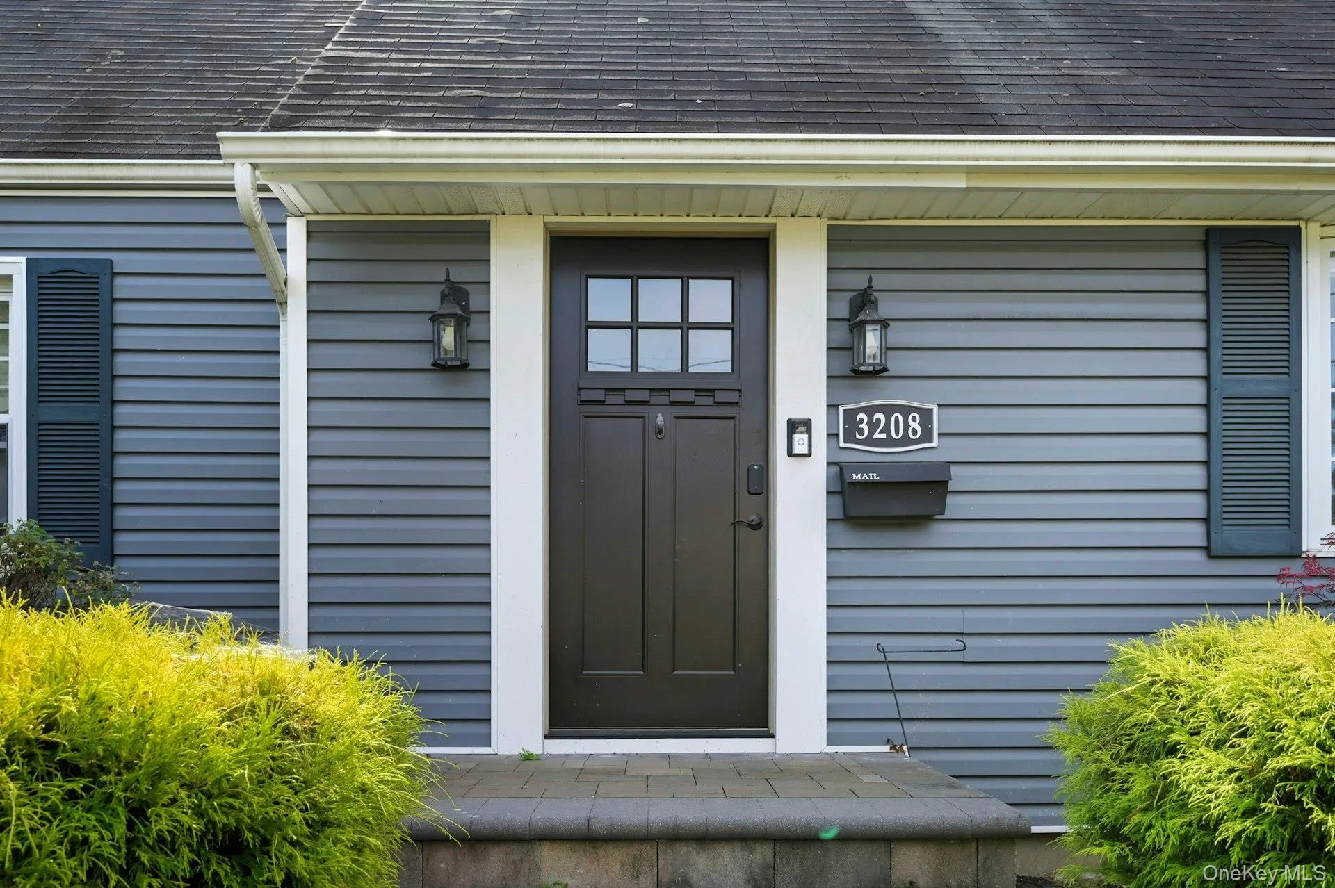 Property entrance featuring roof with shingles Property entrance featuring roof with shingles