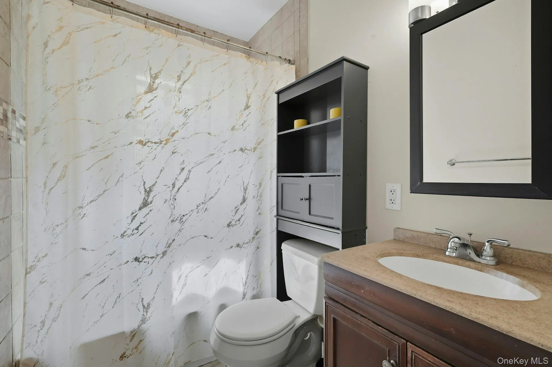 Bathroom featuring vanity and tub/ shower bath Bathroom featuring vanity and tub/ shower bath