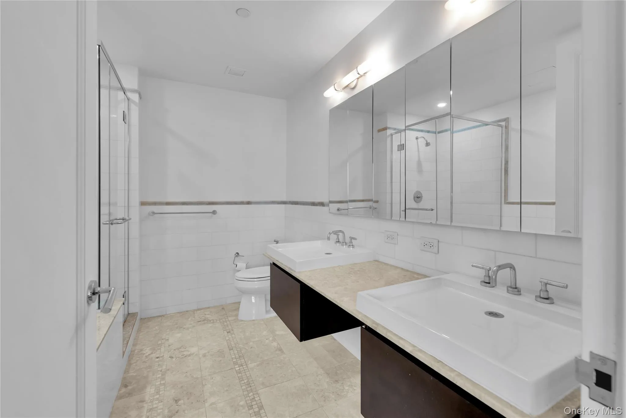 Unwind in your spa-like en-suite with a double vanity, deep jacuzzi tub, and sleek stand-up shower. Unwind in your spa-like en-suite with a double vanity, deep jacuzzi tub, and sleek stand-up shower.