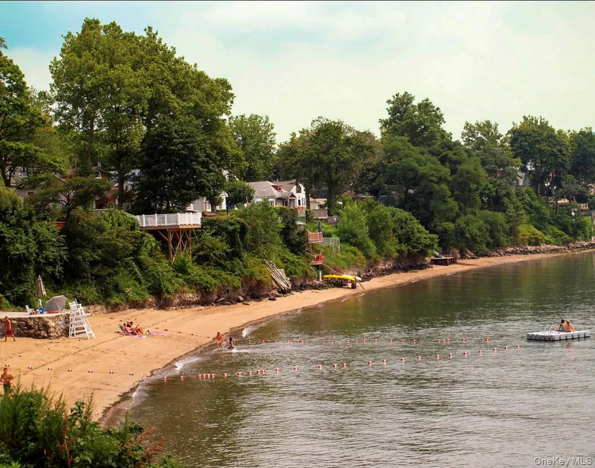 Water view featuring a tree filled landscape Water view featuring a tree filled landscape