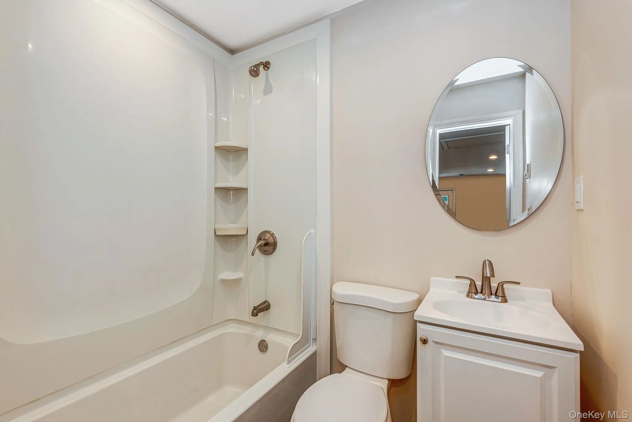 Full bathroom featuring bathing tub / shower combination and vanity Full bathroom featuring bathing tub / shower combination and vanity