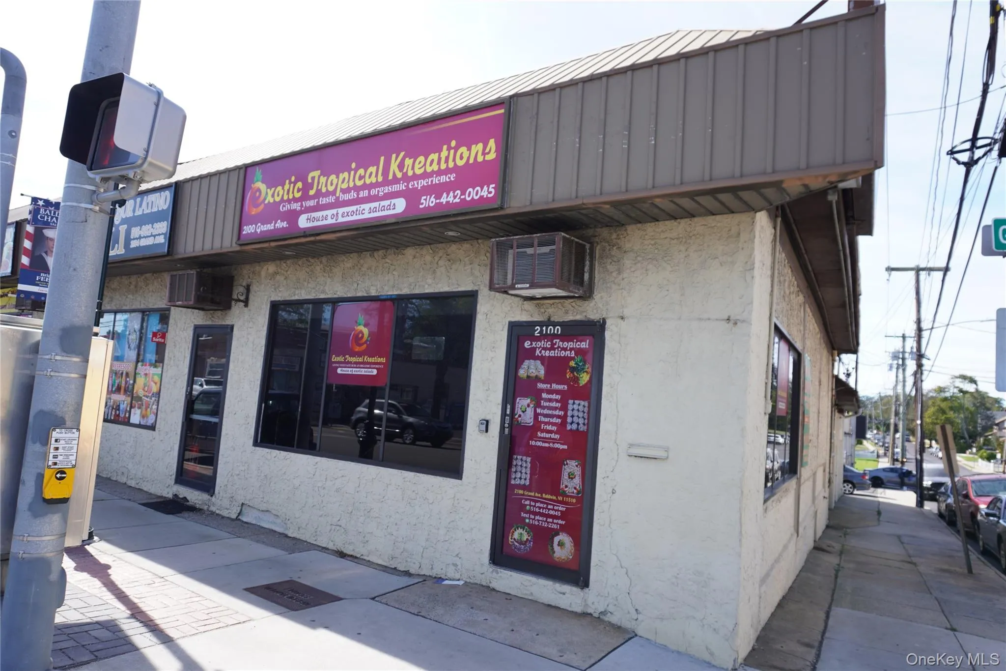 View of property featuring a wall mounted AC View of property featuring a wall mounted AC