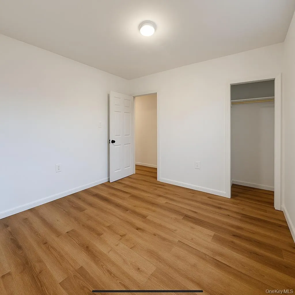 Unfurnished bedroom with light wood-style flooring and a closet Unfurnished bedroom with light wood-style flooring and a closet