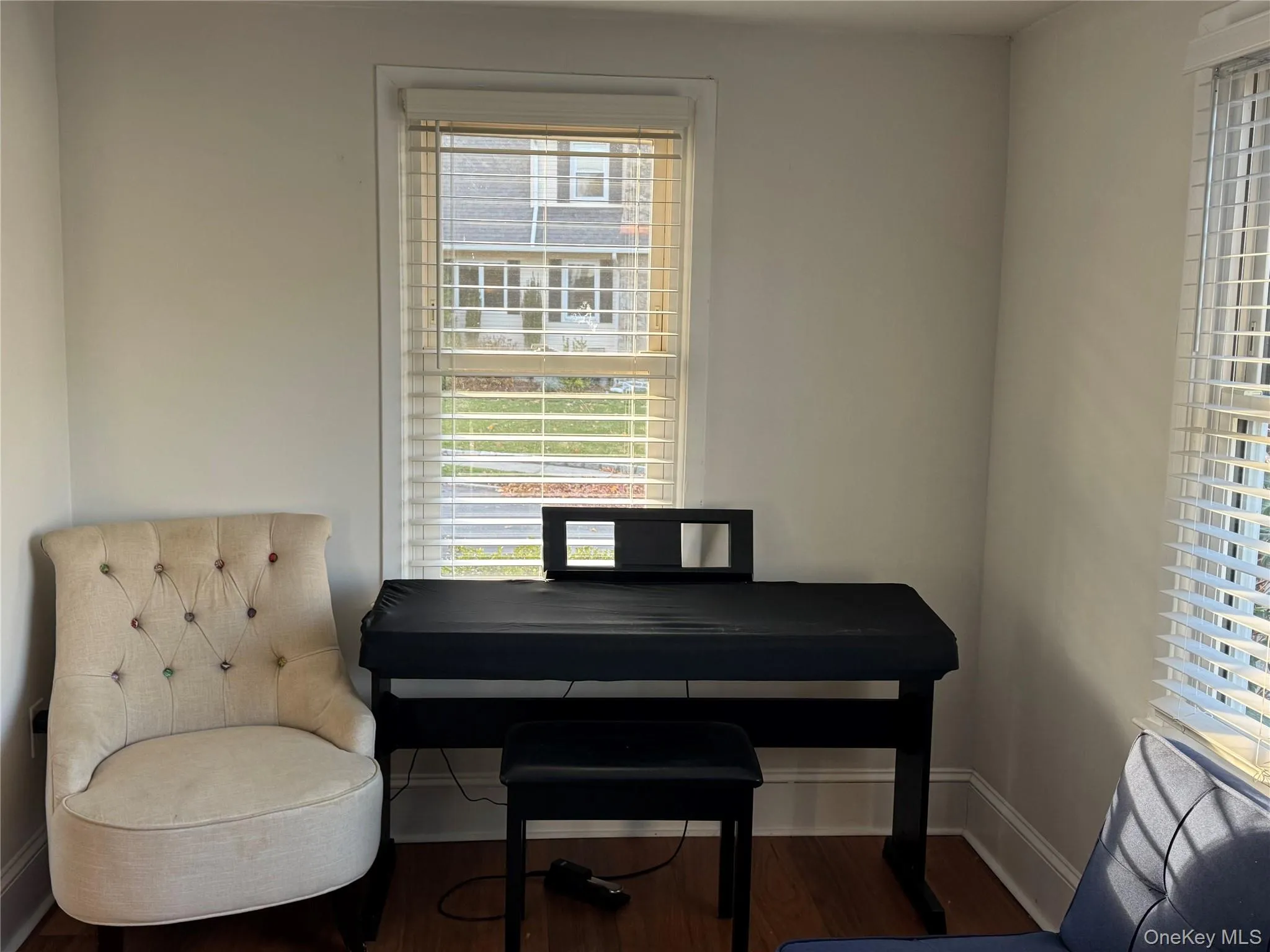 Office area with wood finished floors and baseboards Office area with wood finished floors and baseboards