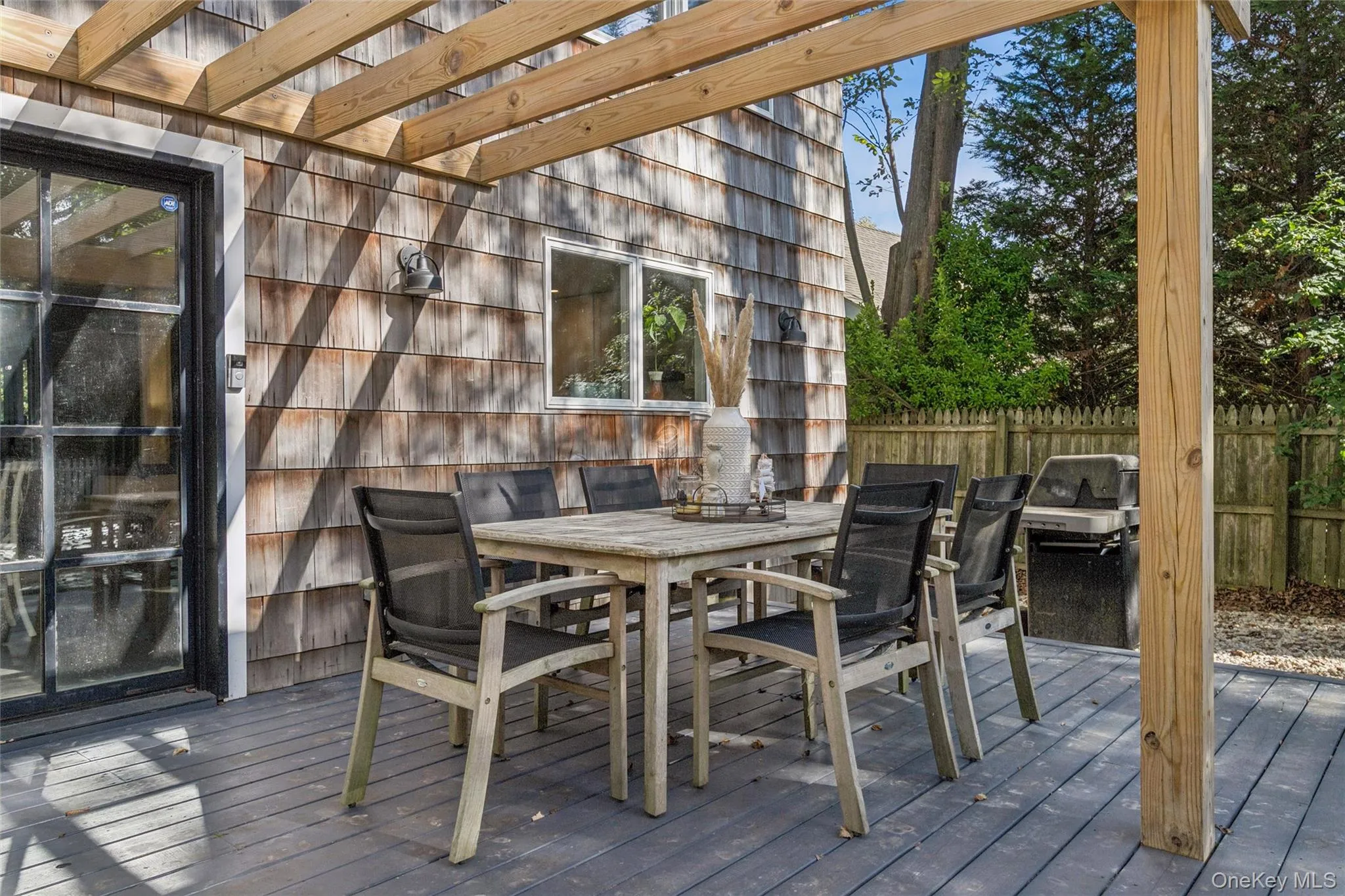 Deck with outdoor dining area and grilling area Deck with outdoor dining area and grilling area