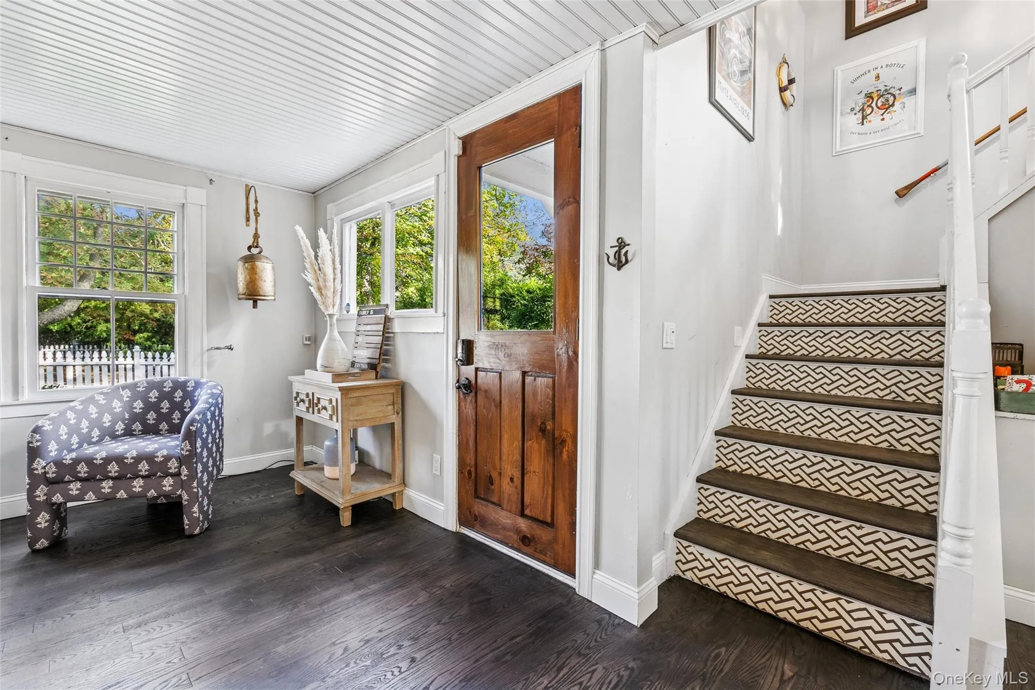 Foyer featuring stairway and dark wood finished floors Foyer featuring stairway and dark wood finished floors