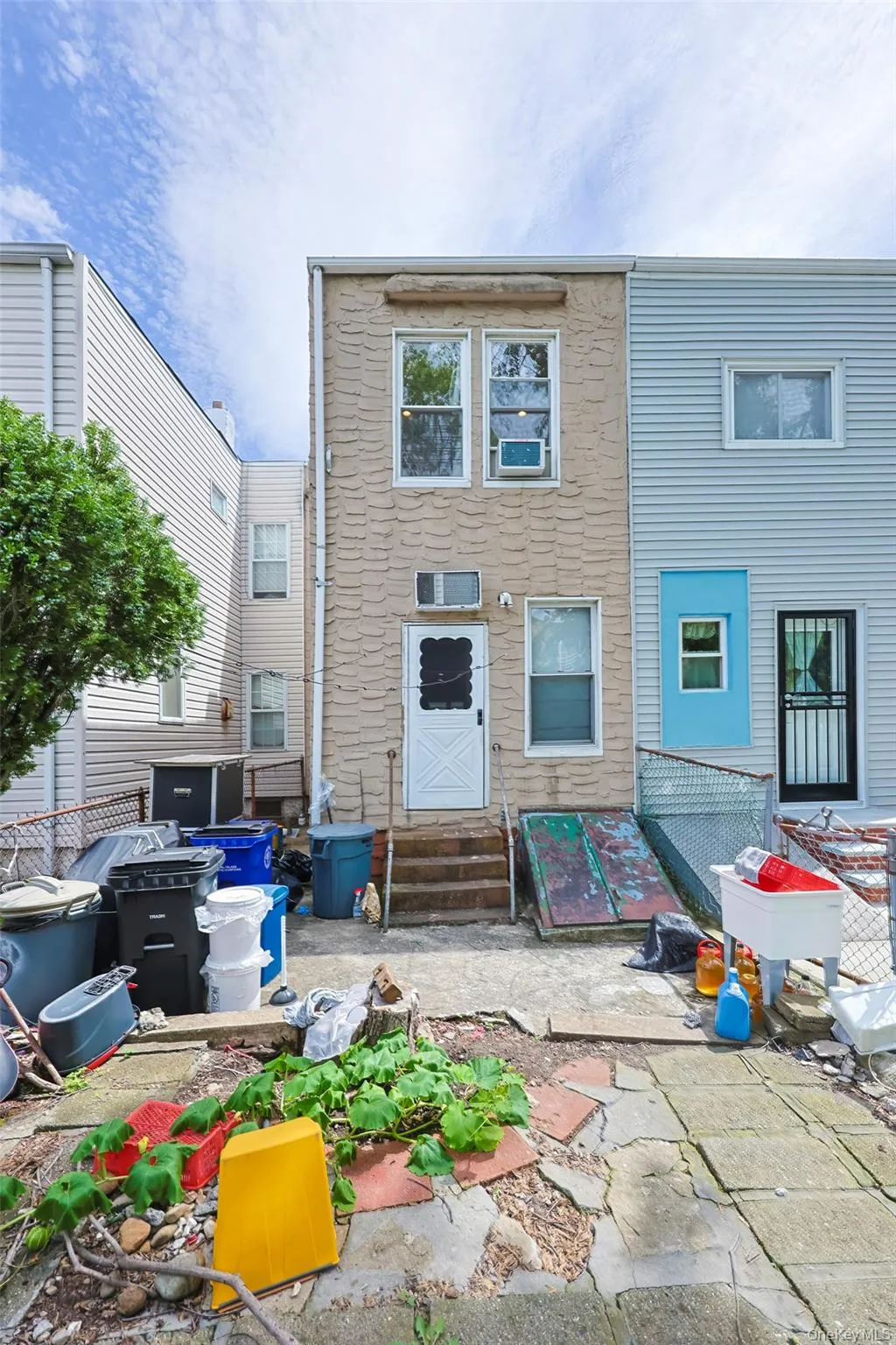 Back of house with a patio area and entry steps Back of house with a patio area and entry steps
