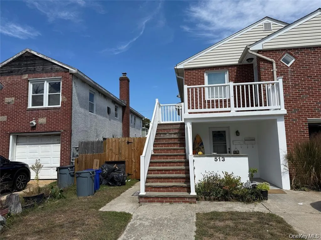 View of front facade with stairs and brick siding View of front facade with stairs and brick siding