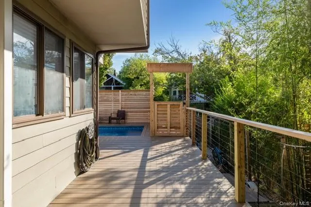 View of wooden balcony with a wooden deck View of wooden balcony with a wooden deck