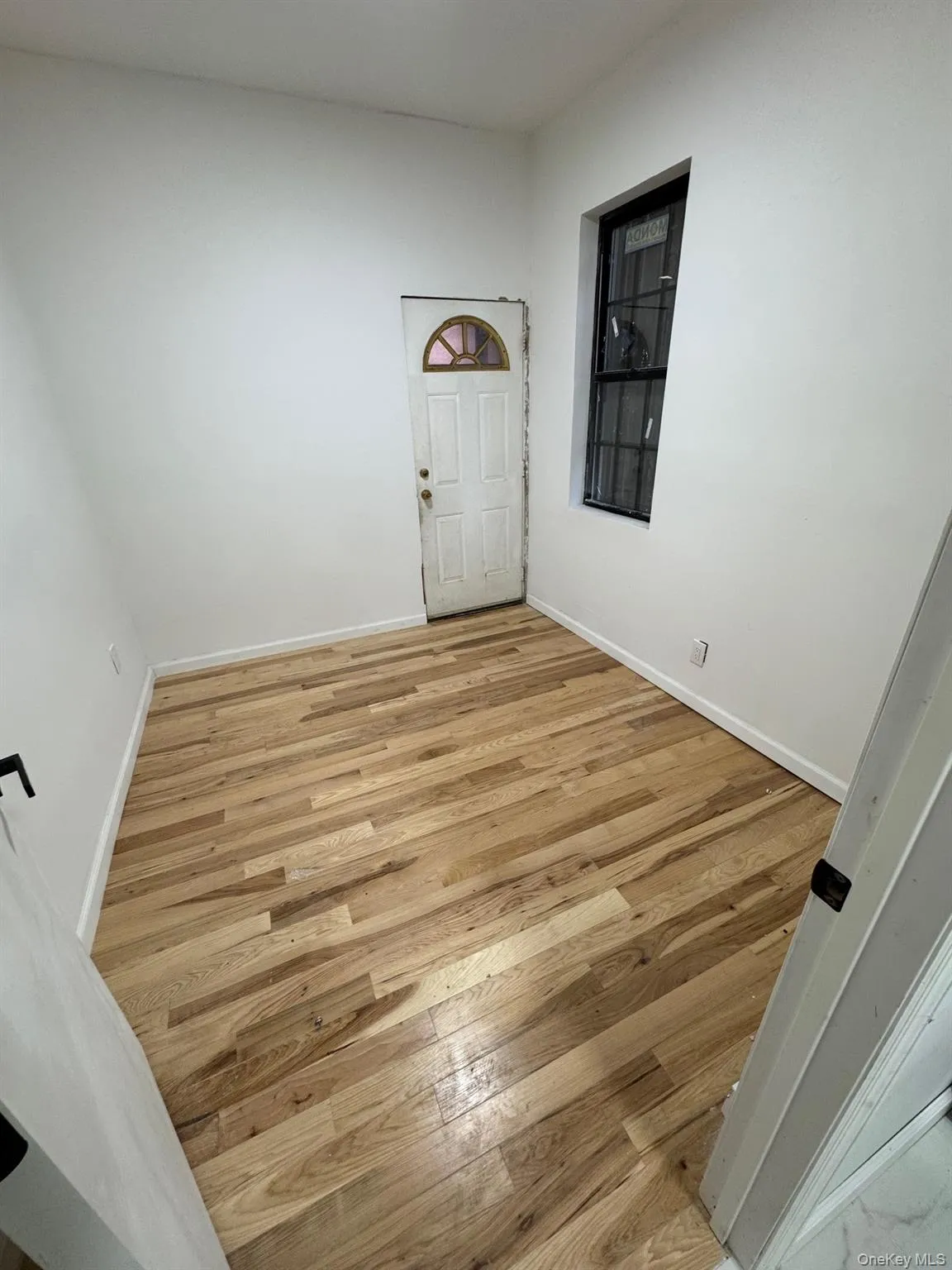 Entryway with light wood-type flooring and baseboards Entryway with light wood-type flooring and baseboards
