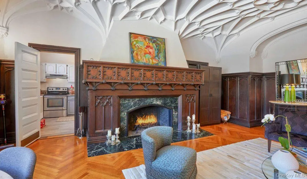 Living room with a premium fireplace and lofted ceiling Living room with a premium fireplace and lofted ceiling