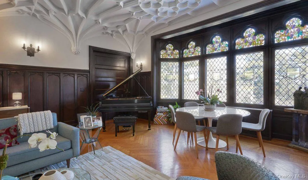 Dining area with wainscoting and a decorative wall Dining area with wainscoting and a decorative wall