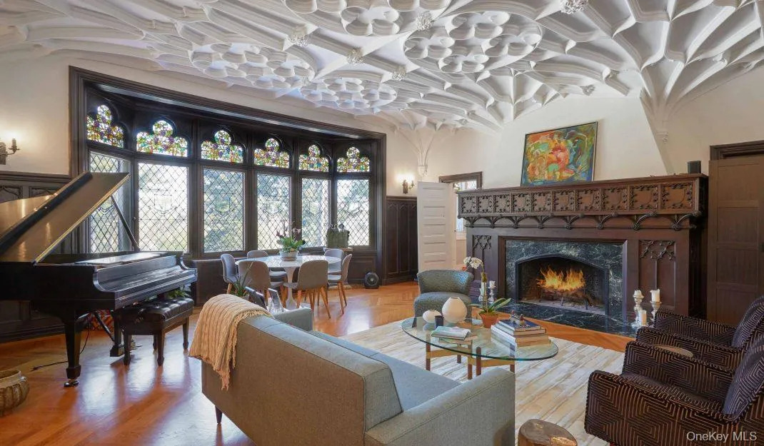 Living area with a fireplace and vaulted ceiling Living area with a fireplace and vaulted ceiling