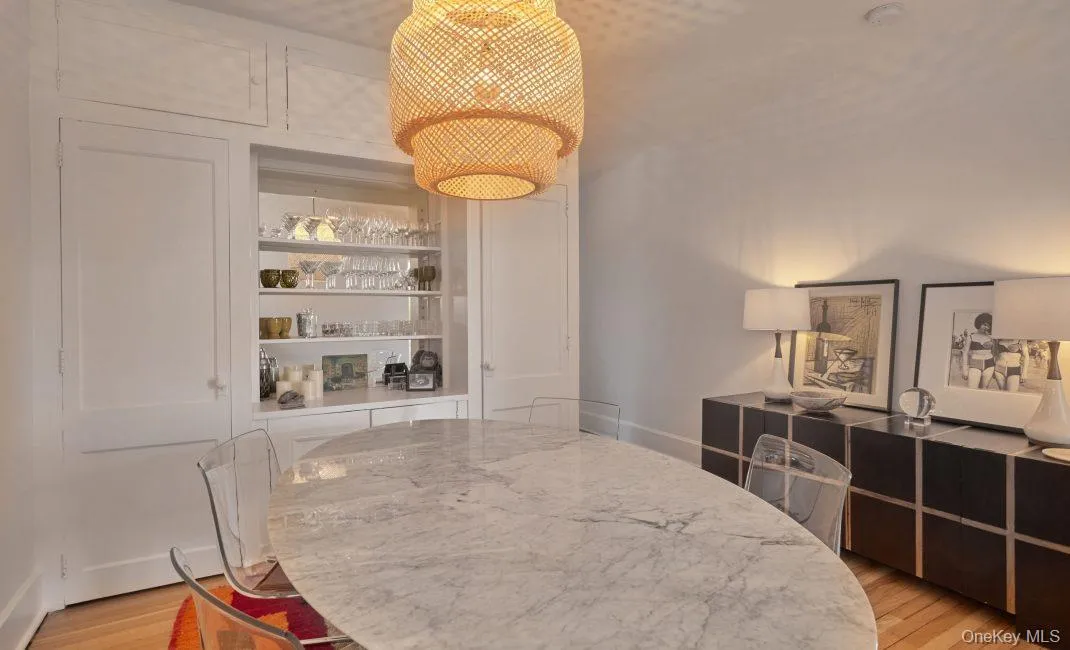 Dining area with light wood finished floors and built in features Dining area with light wood finished floors and built in features