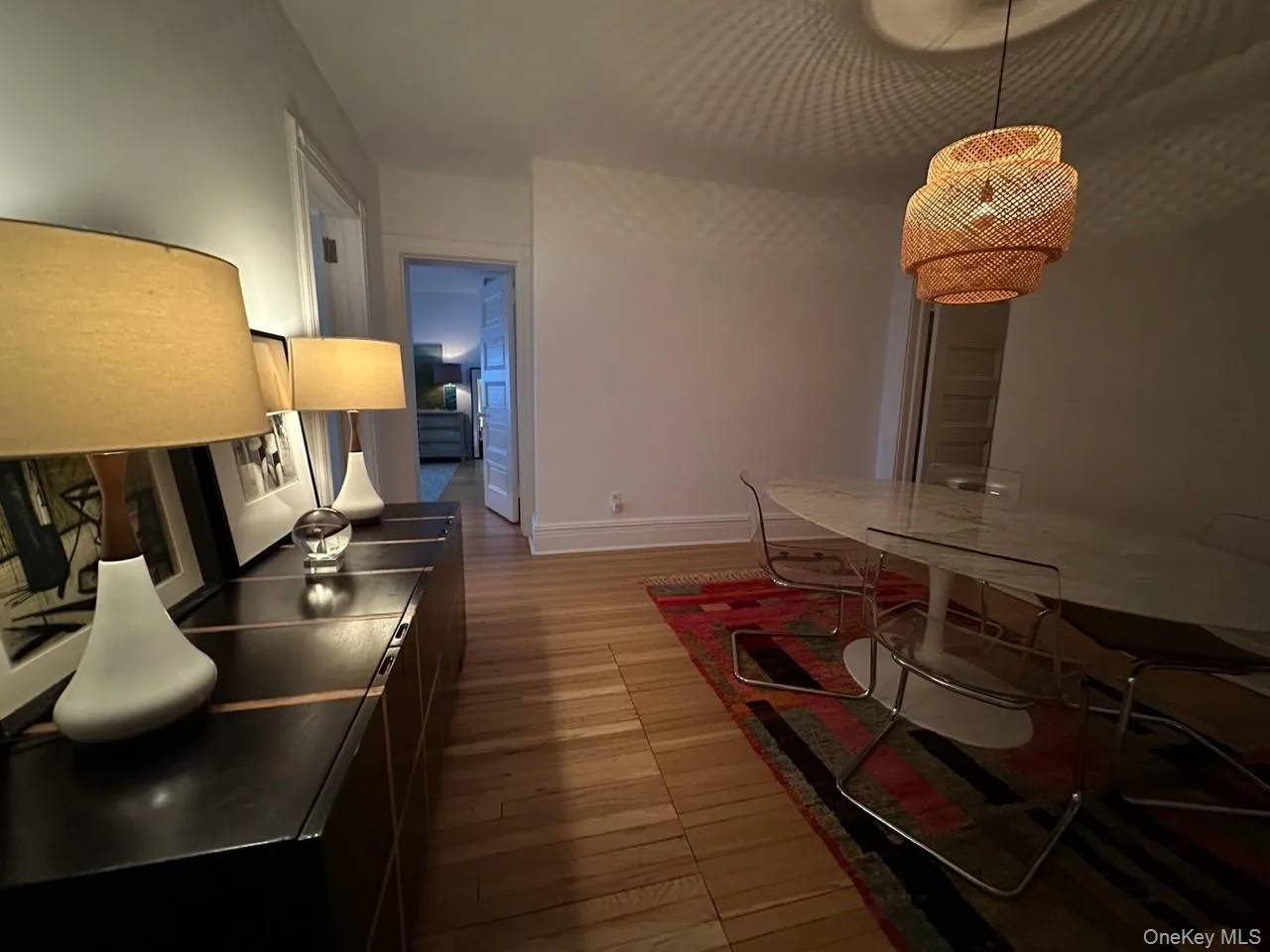 Dining area featuring light wood-style flooring and baseboards Dining area featuring light wood-style flooring and baseboards