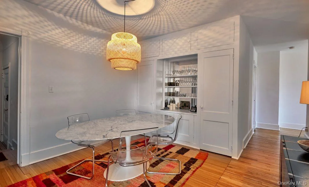 Dining area featuring light wood-style flooring and baseboards Dining area featuring light wood-style flooring and baseboards