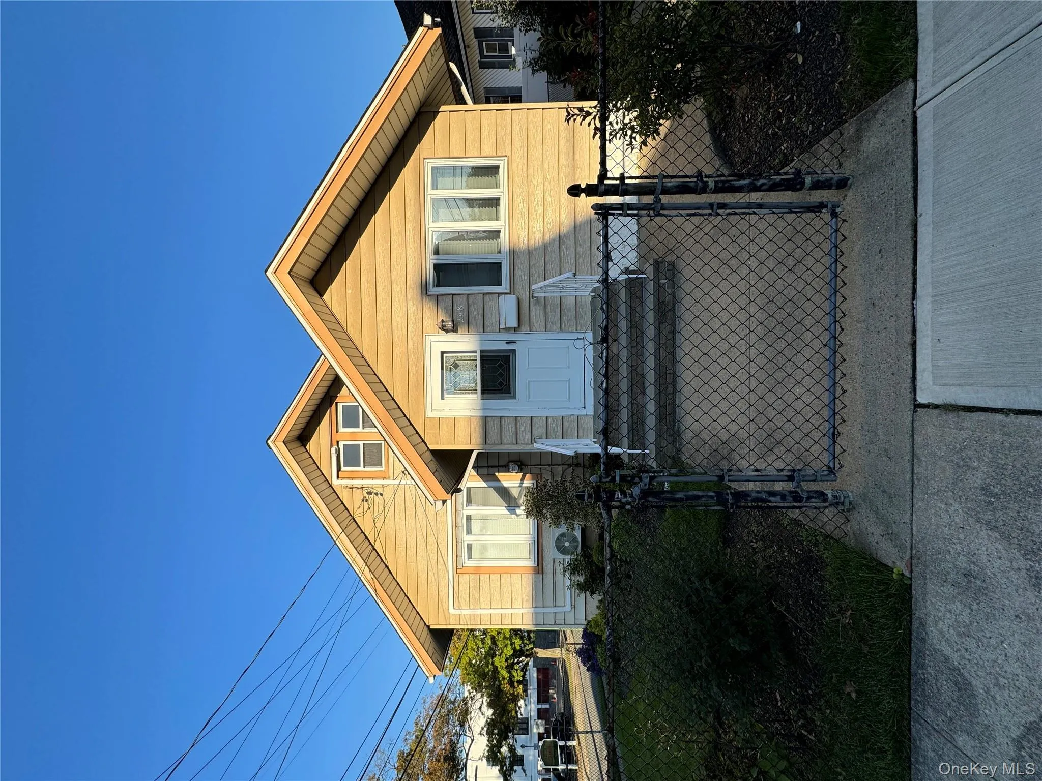 View of front of home with a gate and a fenced front yard View of front of home with a gate and a fenced front yard