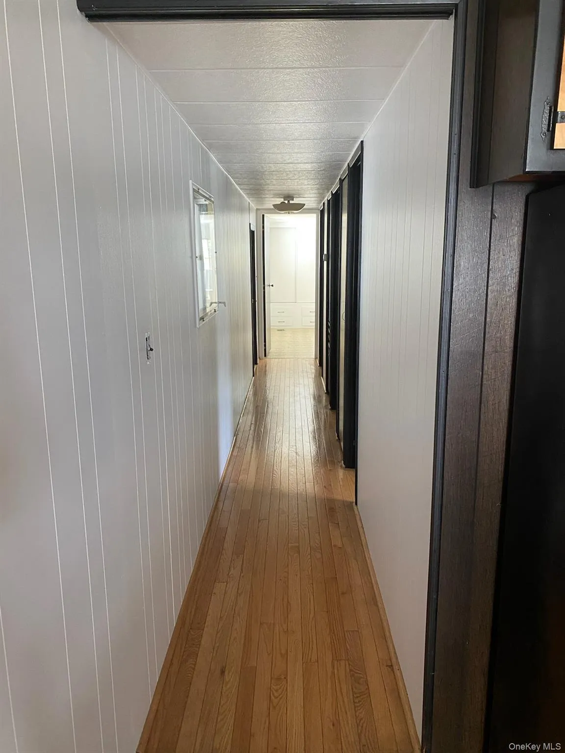 Hallway with light wood finished floors Hallway with light wood finished floors