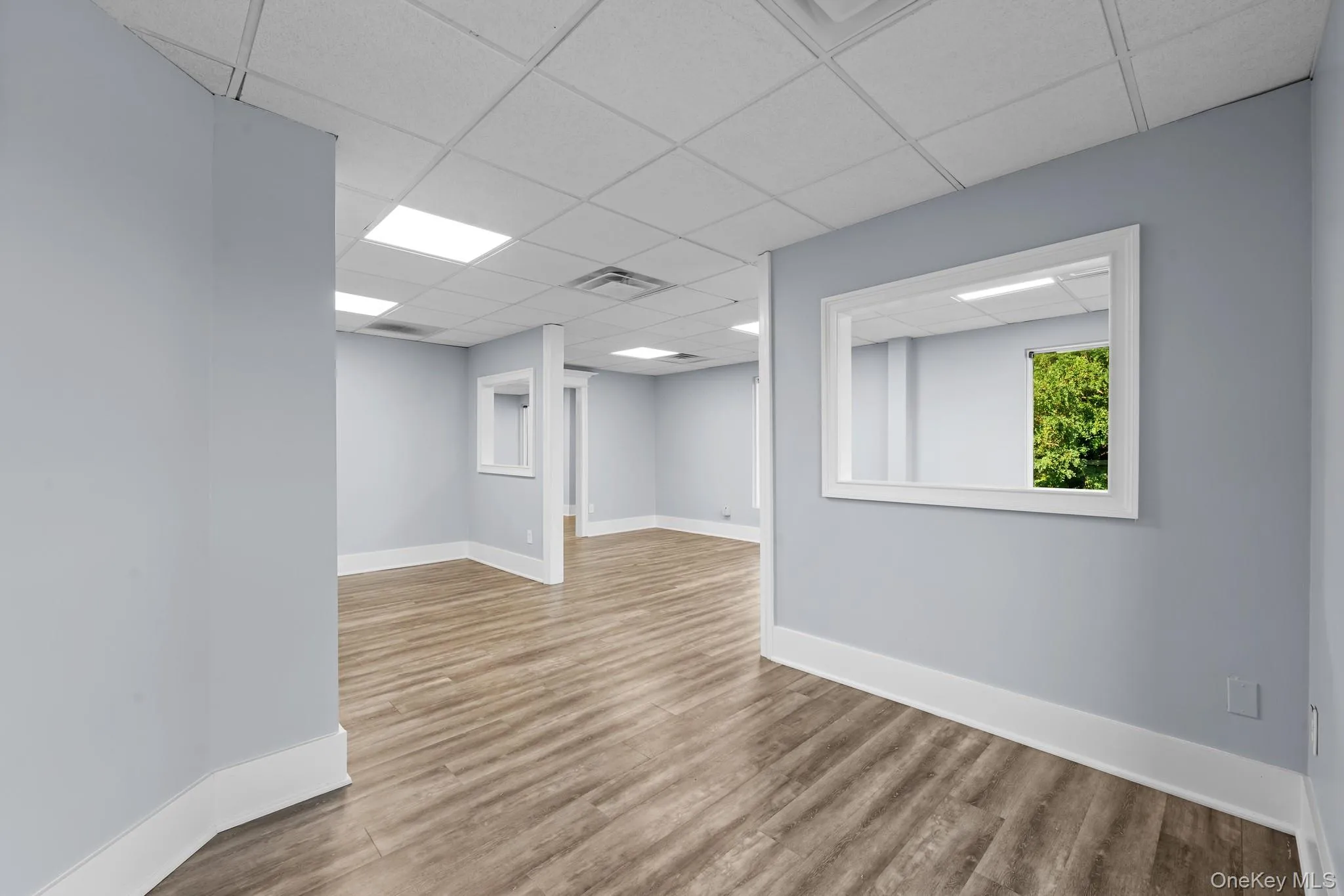 Reception w/ light wood finished floors and a drop ceiling Reception w/ light wood finished floors and a drop ceiling