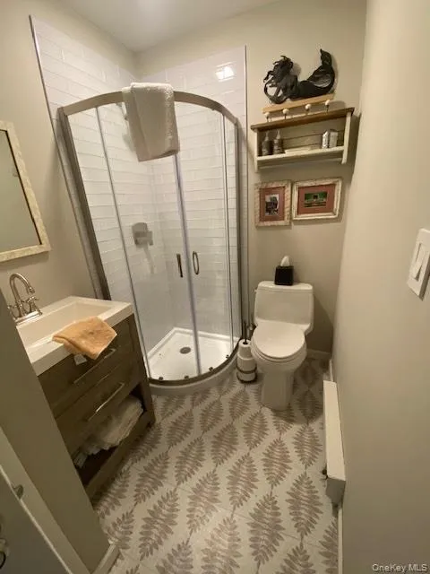 Full bath with vanity and a shower stall Full bath with vanity and a shower stall