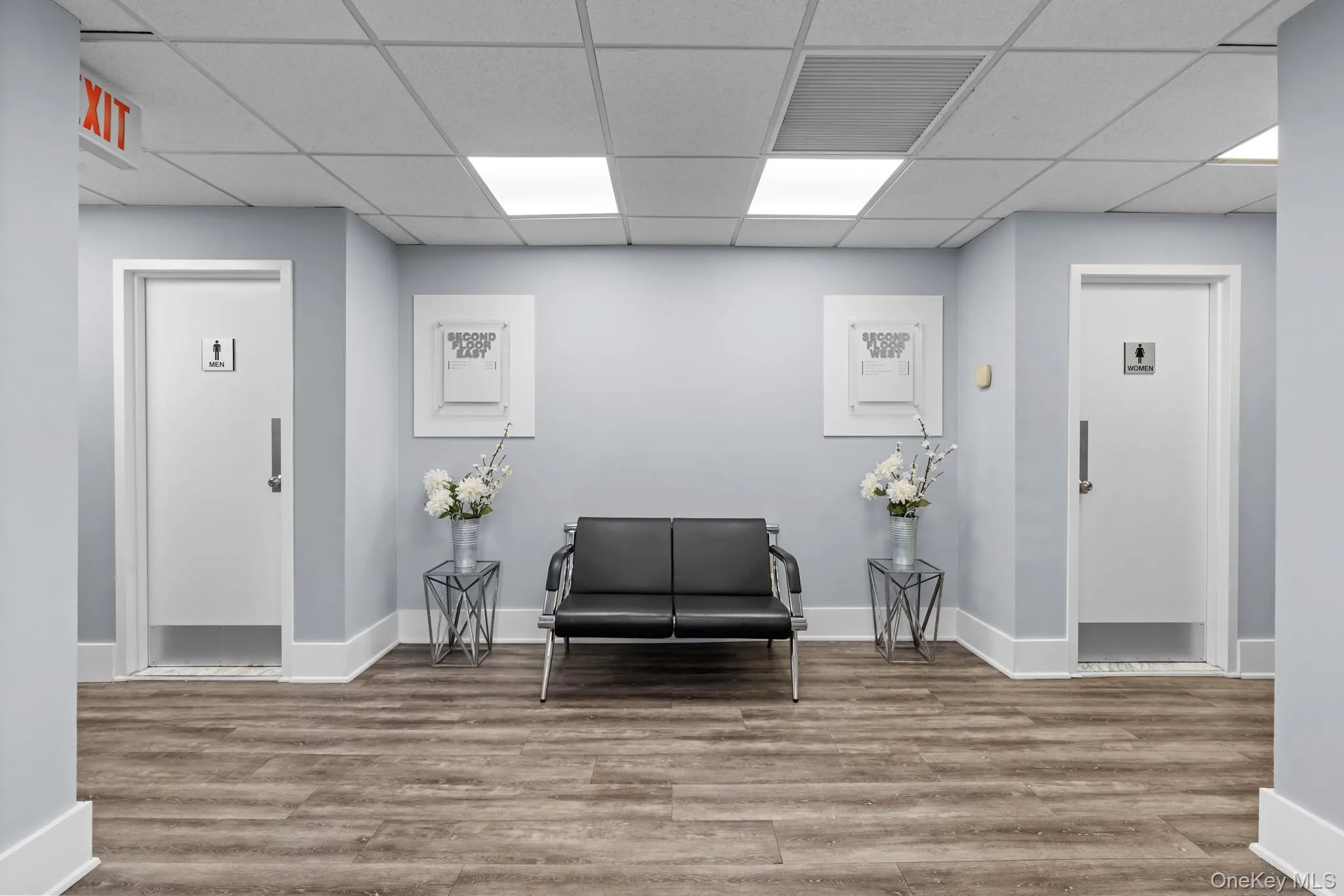 Lobby with restrooms with a drop ceiling Lobby with restrooms with a drop ceiling