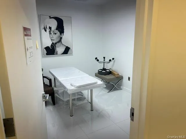 Office with light tile patterned floors Office with light tile patterned floors