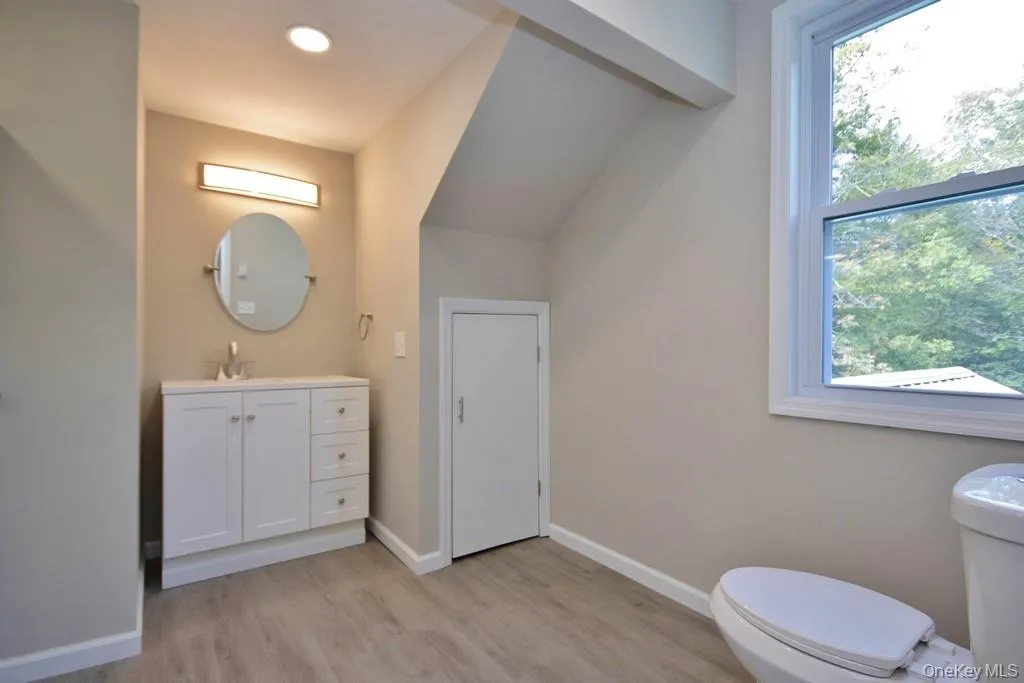 Bathroom with vanity and light wood-type flooring Bathroom with vanity and light wood-type flooring