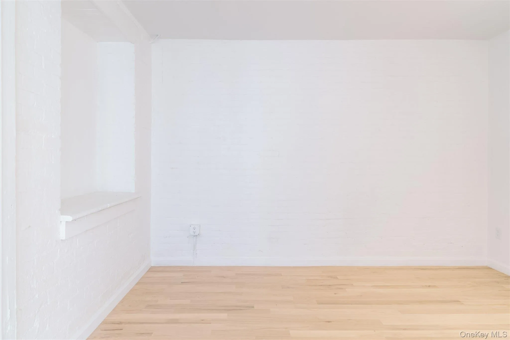 Spare room with wood finished floors Spare room with wood finished floors