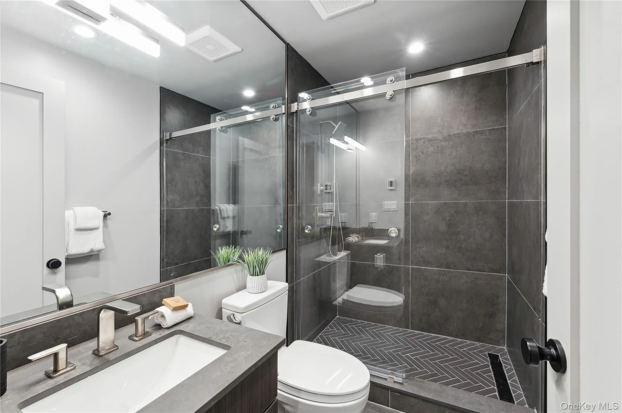 Bathroom with vanity and a stall shower Bathroom with vanity and a stall shower