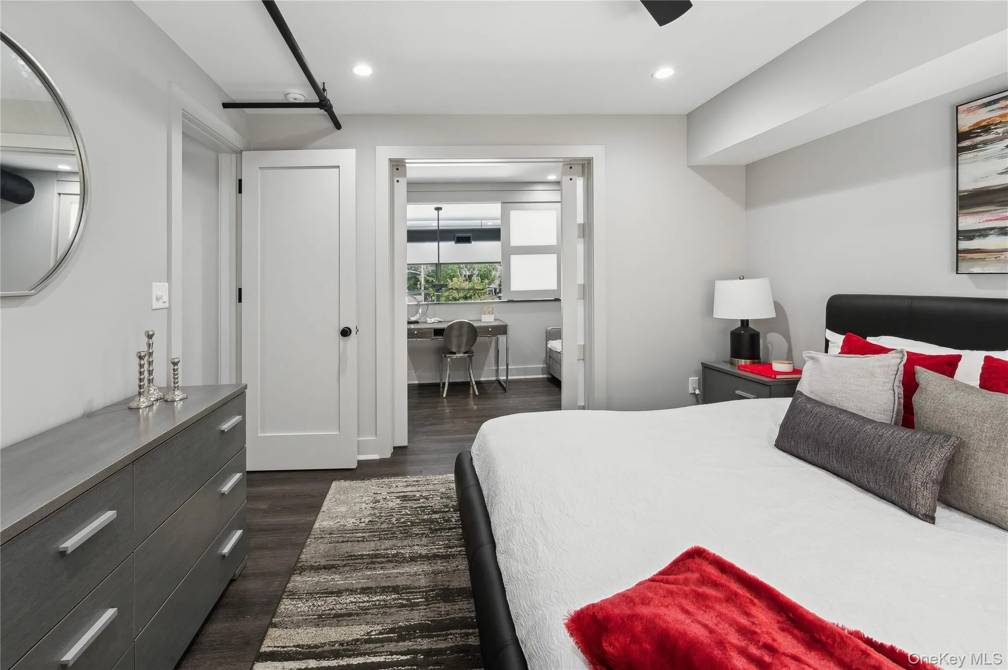 Bedroom with dark wood-style flooring, recessed lighting, and a ceiling fan Bedroom with dark wood-style flooring, recessed lighting, and a ceiling fan