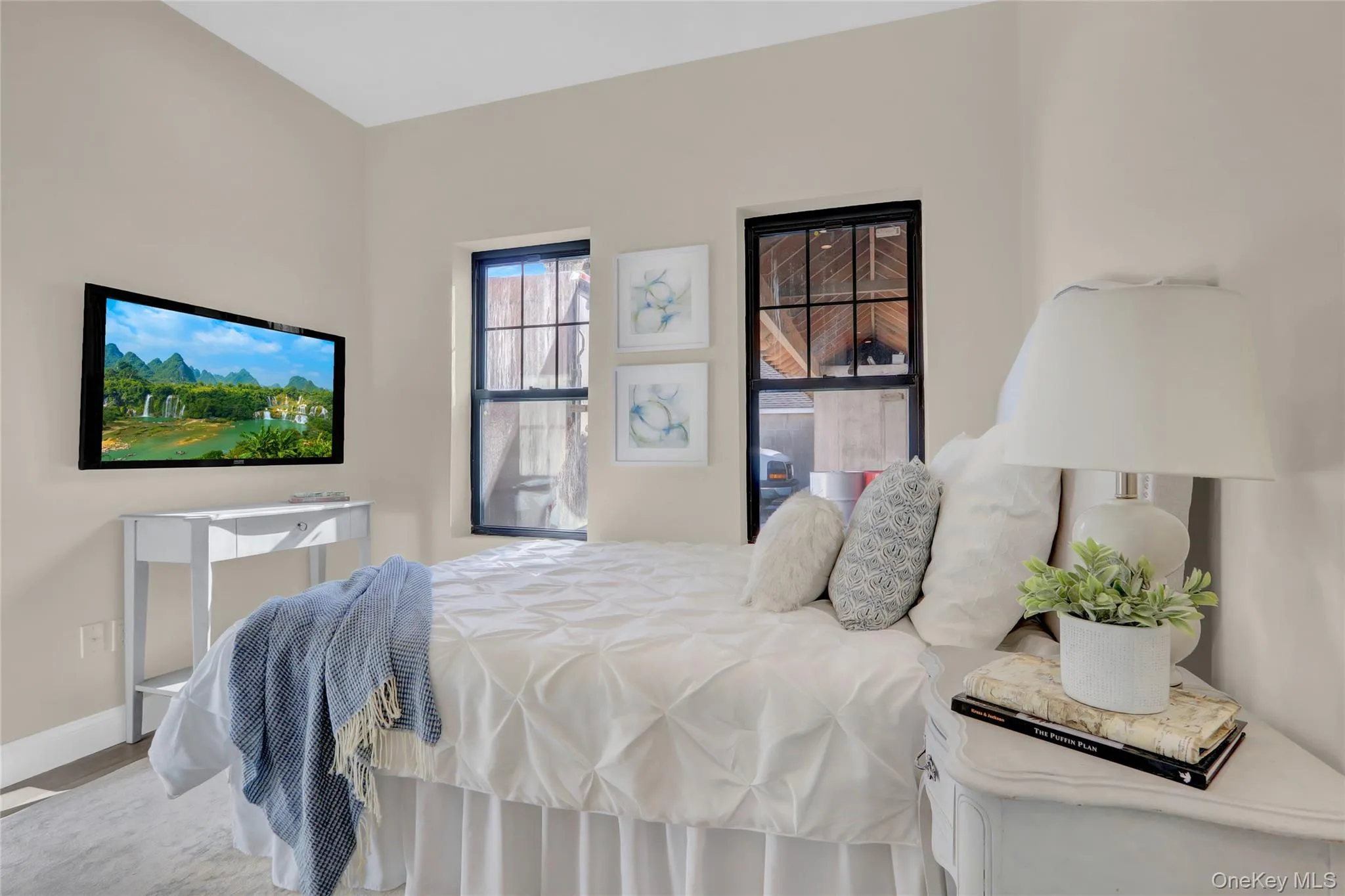 Bedroom with baseboards and wood finished floors Bedroom with baseboards and wood finished floors