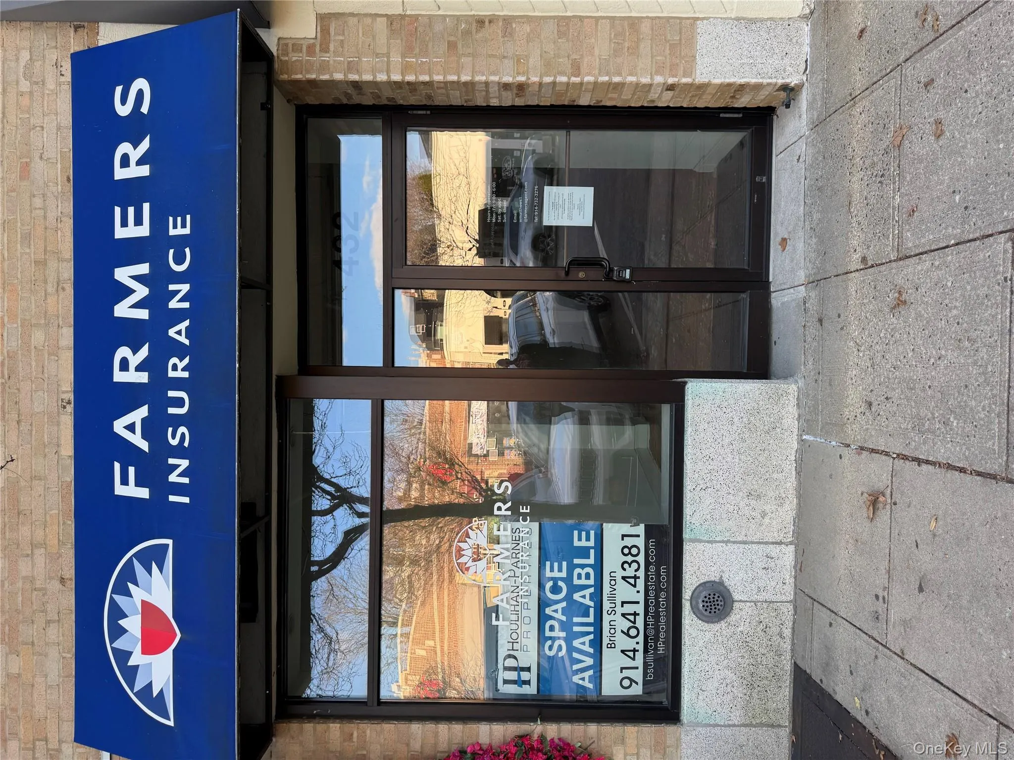 Doorway to property featuring brick siding and french doors Doorway to property featuring brick siding and french doors