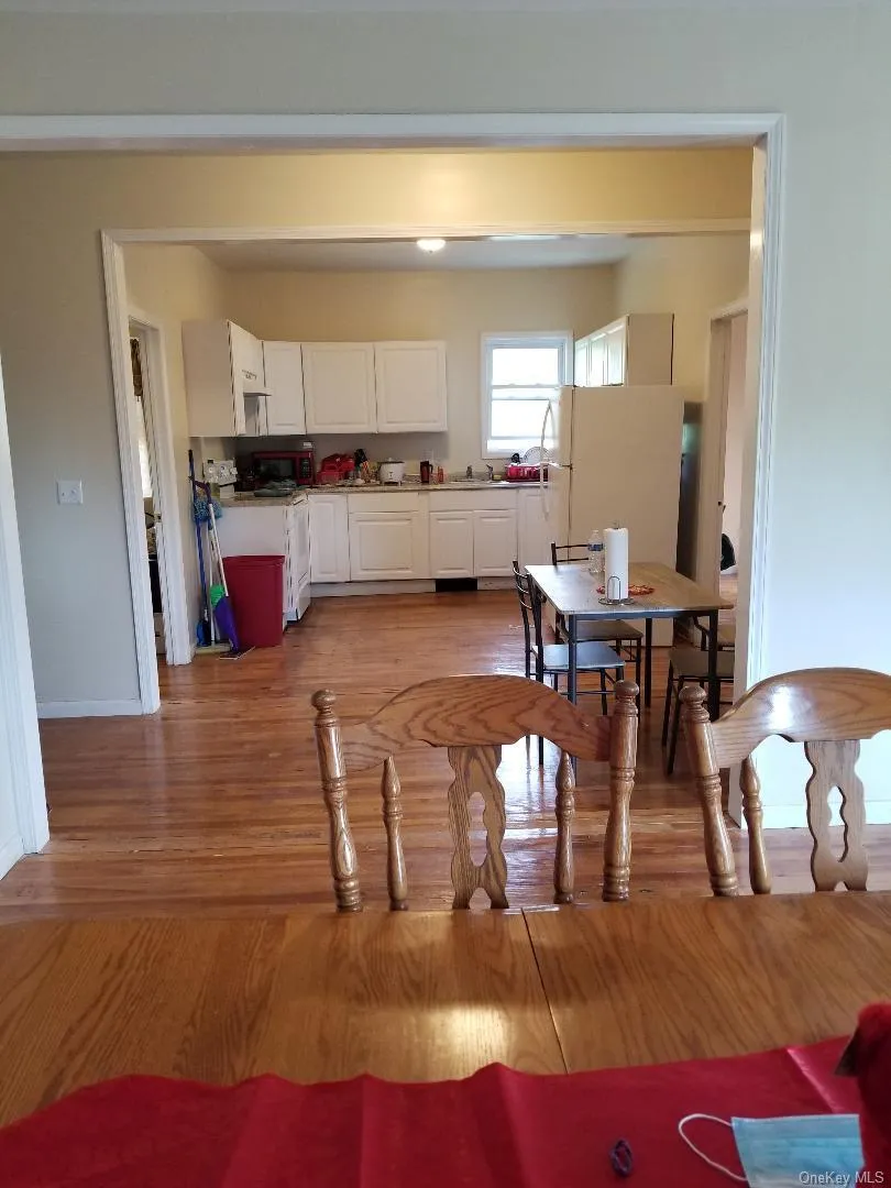 Dining area featuring light wood-style flooring and baseboards Dining area featuring light wood-style flooring and baseboards