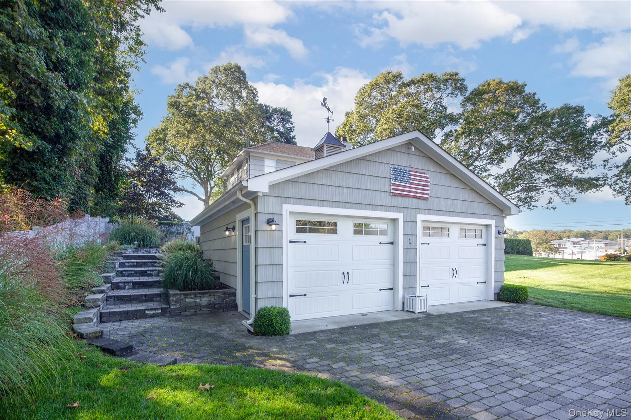 Garage with decorative driveway Garage with decorative driveway