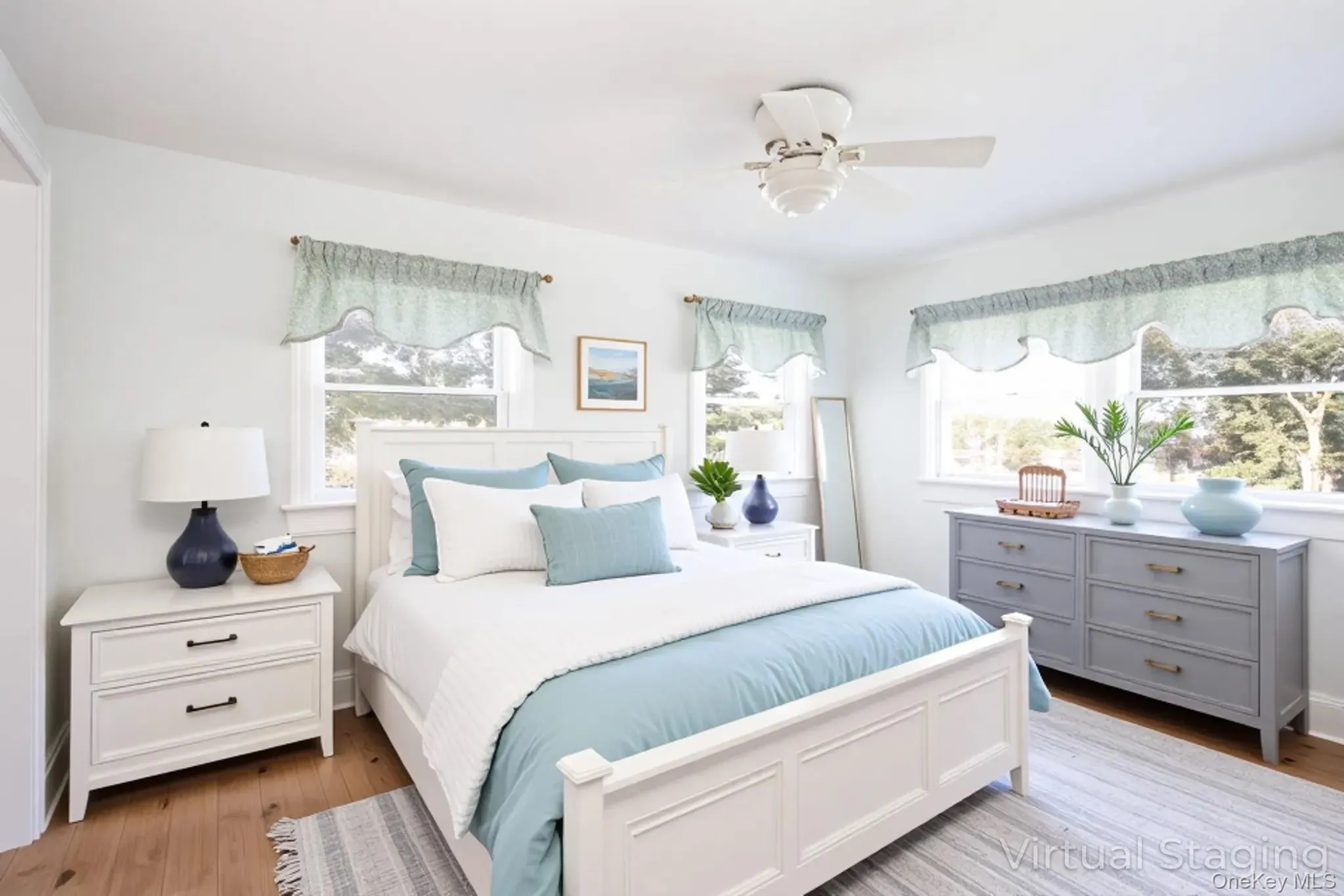 Virtually Staged Bedroom featuring light wood-type flooring and ceiling fan Virtually Staged Bedroom featuring light wood-type flooring and ceiling fan