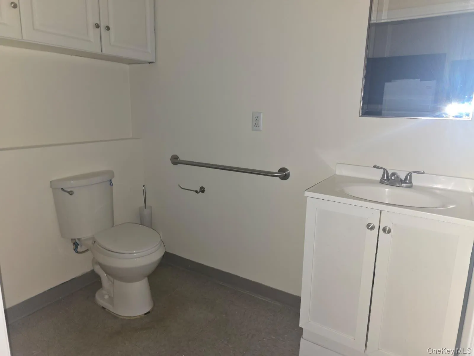 Half bathroom with vanity and toilet Half bathroom with vanity and toilet