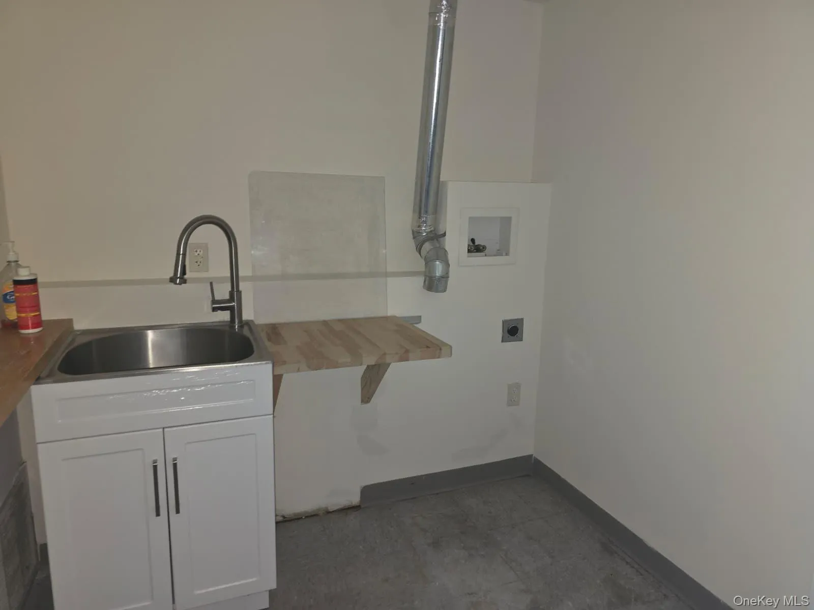 Washroom with cabinet space and washer hookup Washroom with cabinet space and washer hookup