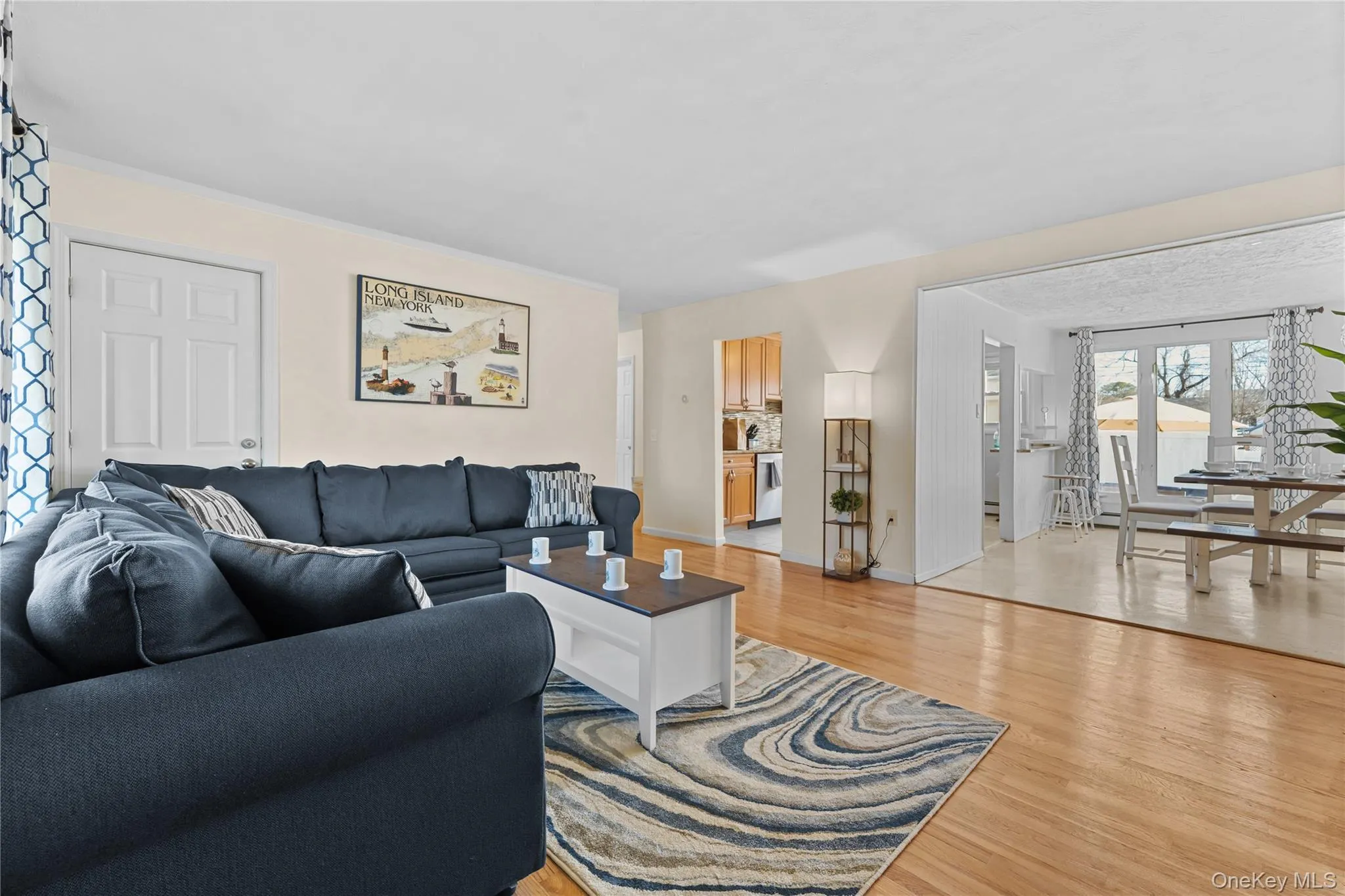 Living area featuring light wood finished floors and baseboards Living area featuring light wood finished floors and baseboards
