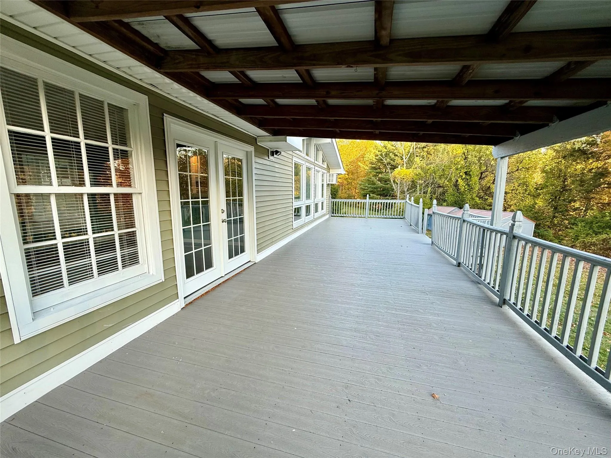 Wooden terrace featuring french doors Wooden terrace featuring french doors