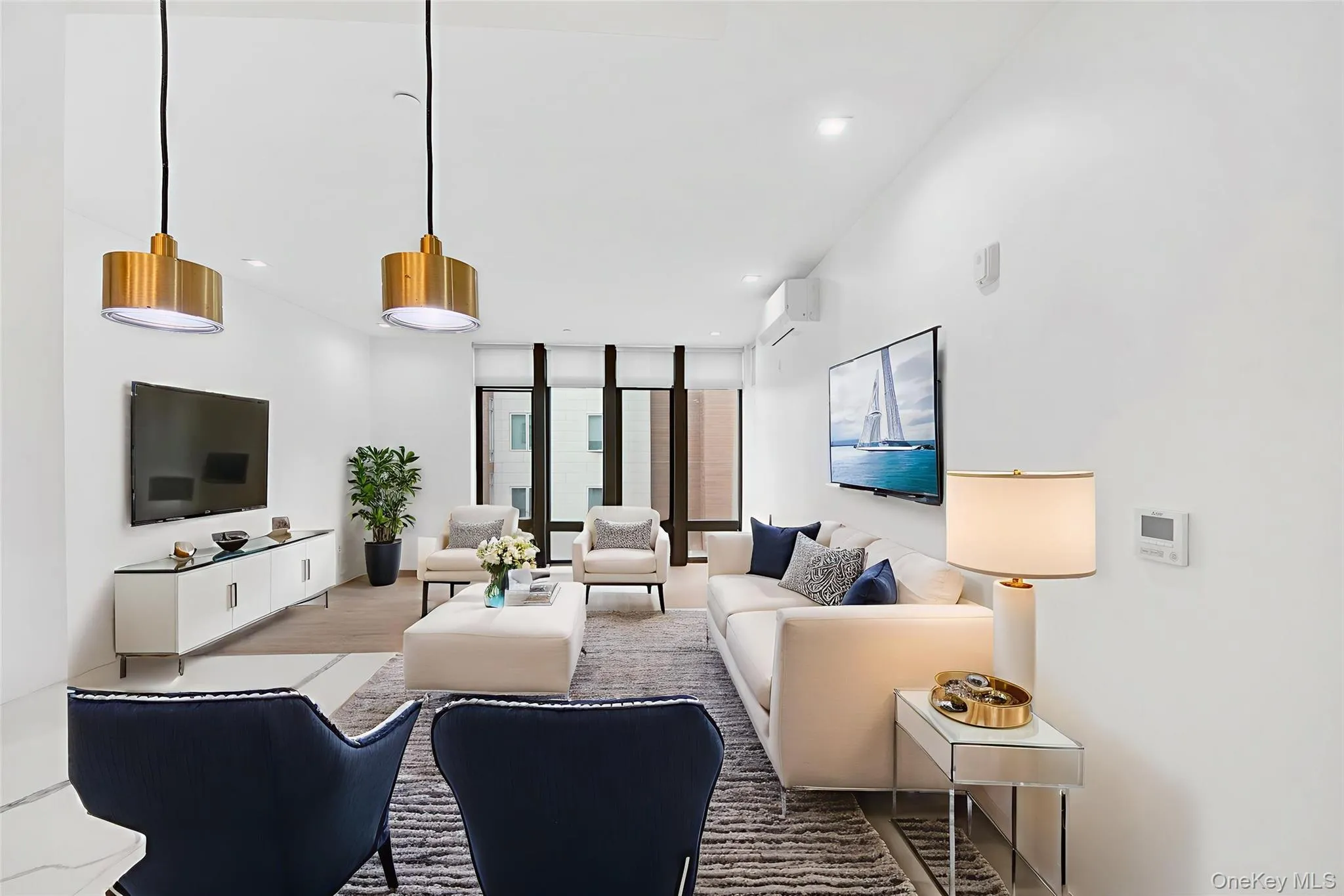 Living room featuring floor to ceiling windows, wood finished floors, recessed lighting, and a wall unit AC Living room featuring floor to ceiling windows, wood finished floors, recessed lighting, and a wall unit AC