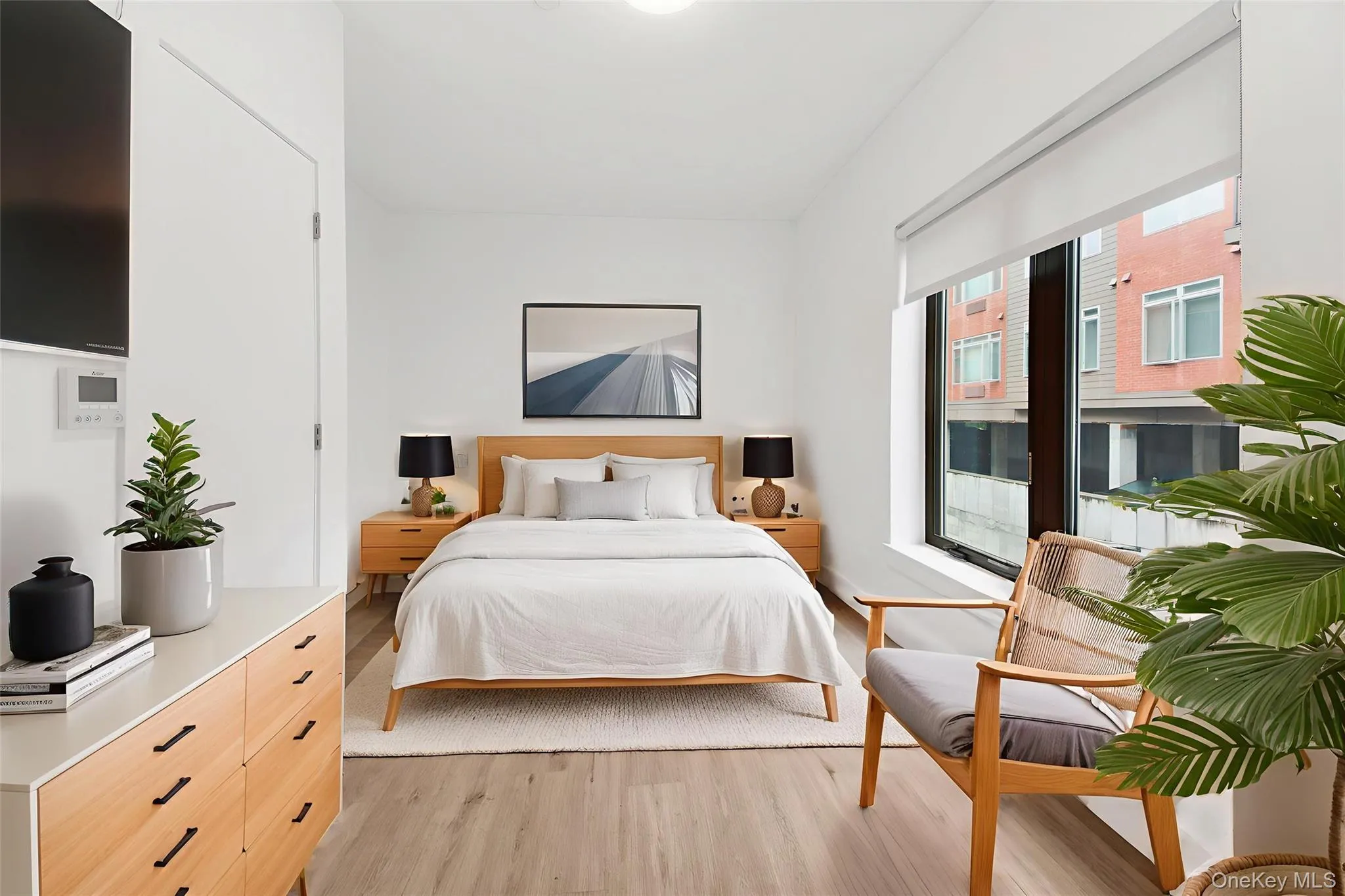 Bedroom featuring light wood-style floors Bedroom featuring light wood-style floors