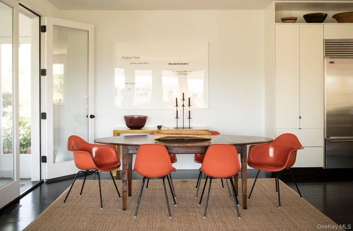 Dining space featuring dark wood-style floors Dining space featuring dark wood-style floors